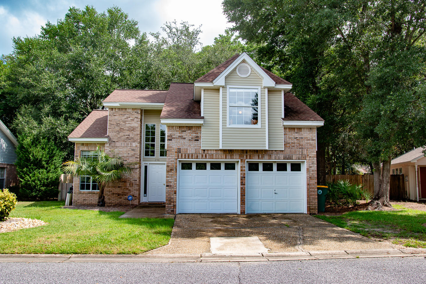Adorable1693 SF 3 bedroom, 2.5 baths with a 2 car garage on Parkwood Circle. This home offers 17' ceilings in the living area with lots of windows for plenty of natural light and gas fireplace flanked by built in bookshelves and cabinets. There is an office just off the living area that also has a built in computer desk. The living area opens onto a screened in porch complete where you can enjoy outdoor dining or enjoy a cool evening by the gas chiminea. The dining area also has lots of windows offering views of the porch and fenced backyard. The kitchen is just past the dining area and offers a cozy area to dine as well as access to the backyard. There is a laundry room just off the kitchen and leads to the garage. All the bedrooms are upstairs with the Master to the left and the guest bath and other two bedrooms to the right. Master baths features double sink vanity, garden tub, and separate shower. Shopping and dining are within walking distance and the Mid Bay Bridge connection is quick trip to drop you right into the heart of Destin to enjoy the beaches and an abundance of shopping and dining. This won't last long so call today to schedule a showing.