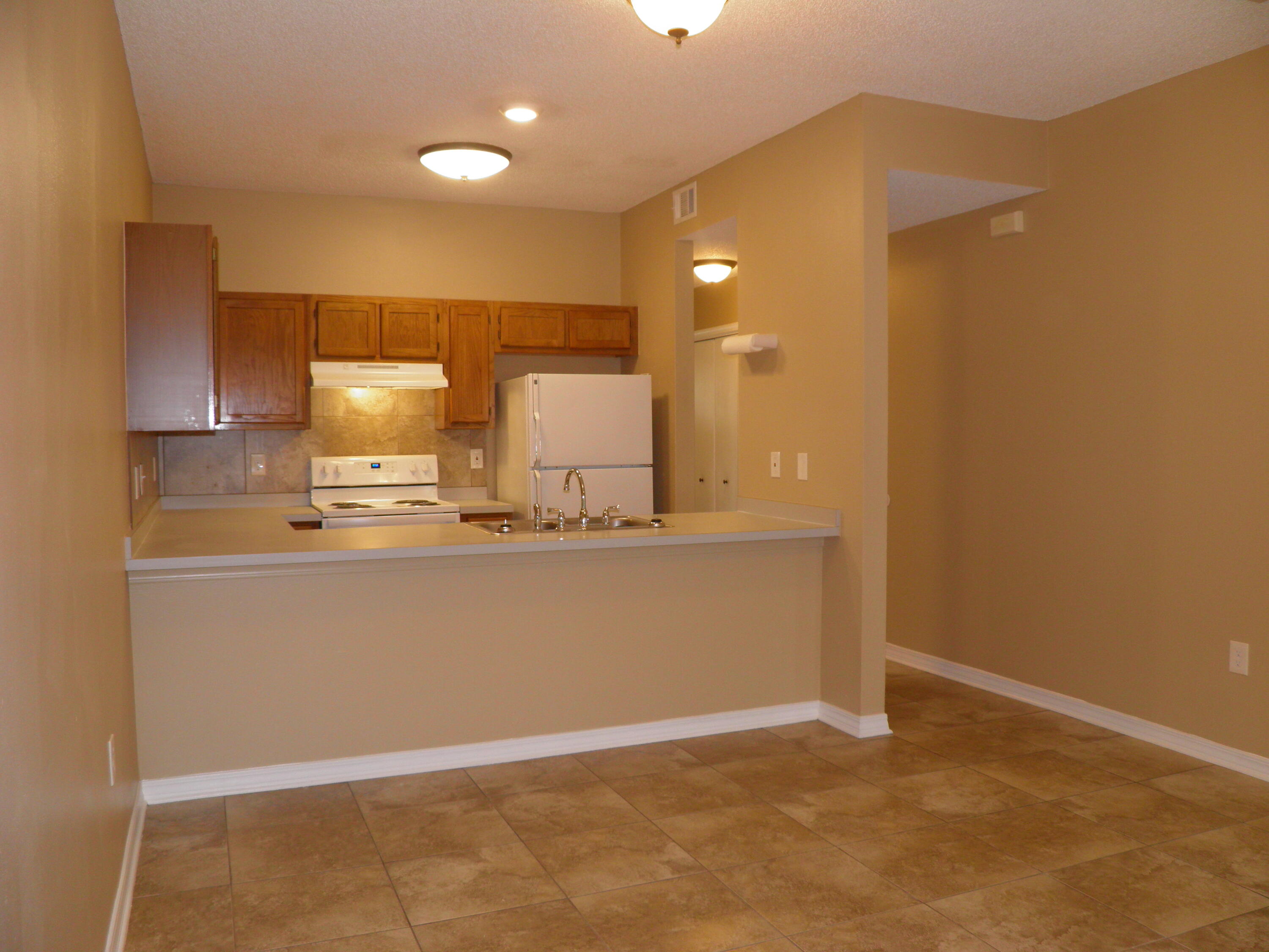 Look no further!  No yard maintenance here.   NO CARPET anywhere.  Exceptionally clean and fresh, renovated 3 bedroom, 2 full baths townhouse.   Huge outdoor patio area. Very close to shopping, beaches and military bases.

Neutral colors throughout.    New wood grain luxury vinyl plank floors on the upper level and stairwells.  Lower level fully tiled.  

Two large bedrooms and one full bathroom on the upper level.  Office/Bedroom/Gathering room located downstairs.  This room has full access to a  huge outdoor patio area.  Washer/Dryer hookups on the lower level.

No smoking.  No vaping.  No animals.

Viewing by appointment only.

Final rent payment and security deposit is subject to review of the application.