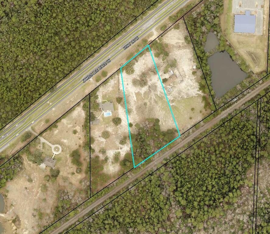Your Future Dream Home Will Look Amazing on this 4.4-acre partials located on James Lee Blvd (HWY 90) just before the Milligan bridge.  Easy commute to all points south and just minutes from HWY 85 & 90.  Bring you builder and floor plans and make this beautiful 4.4 acre parcel you new place to call home.   Utilities are available at the street.