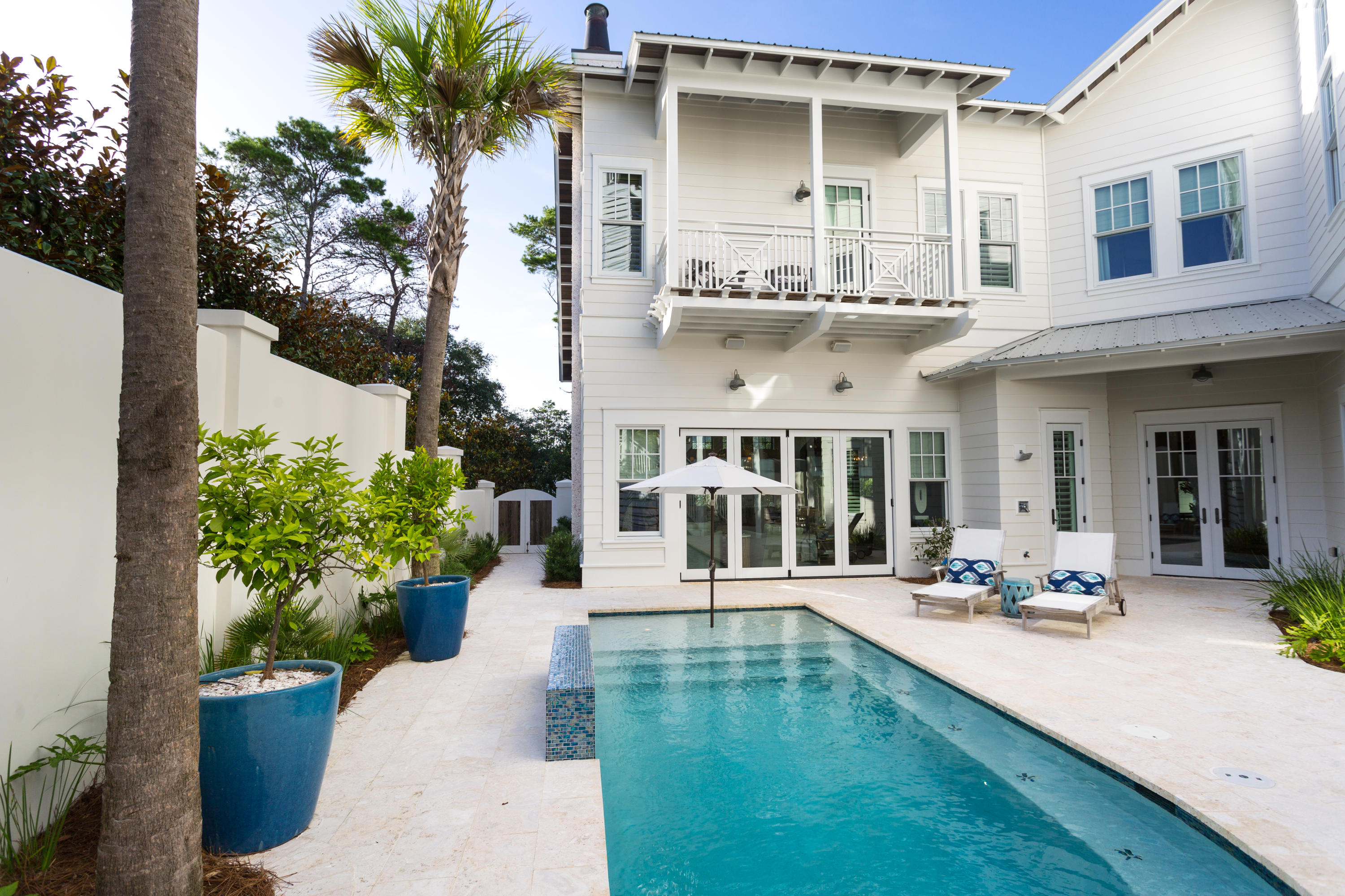 A true sanctuary in a highly coveted location in Old Seagrove, this 5BR/6.5BA Gulf view retreat was custom-built by Alex Rice of Old Seagrove Homes. Private courtyard walls surrounding an outdoor oasis with a gunite saltwater pool, a fire pit and a grilling and dining area creates a peaceful, secluded ambiance yet the beach, Seaside and WaterColor are just steps away. Every detail of this home has been meticulously selected and the quality of materials is evident from the moment you enter the gorgeous Mahogany front door. A chic coastal style creates a bright and sunny vibe where pecky cypress accents contrast with white walls and carefully chosen design features such as a grand tabby shell fireplace in the living room. A true sanctuary in a highly coveted location in Old Seagrove, this 5BR/6.5BA Gulf view retreat was custom-built by Alex Rice of Old Seagrove Homes. Private courtyard walls surrounding an outdoor oasis with a gunite saltwater pool, a fire pit and a grilling and dining area creates a peaceful, secluded ambiance yet the beach, Seaside and WaterColor are just steps away. Every detail of this home has been meticulously selected and the quality of materials is evident from the moment you enter the gorgeous Mahogany front door. A chic coastal style creates a bright and sunny vibe where pecky cypress accents contrast with white walls and carefully chosen design features such as a grand tabby shell fireplace in the living room.

Over 4,600 square feet of thoughtfully designed spaces allow ample room for families or groups of all kinds to gather where all the luxuries expected plus more are available in this one-of-a-kind home. Highlights include a professional kitchen with custom cabinetry, Thermador Pro Series appliances and Bianca Macaubus Quartzite counters, a full-fold French door system that creates a seamless indoor/outdoor experience between the living room and pool courtyard, an exquisite master suite complete with a morning kitchen, a sitting area and a private balcony and a themed bunk room with four custom-designed double bunks. A lookout tower offers breathtaking and expansive views of the Gulf due to the high elevation of the lot which is also one of the largest available in this area of Seagrove Beach. Spacious closets, storage areas and a two-car garage make it easy to store all of the necessities of a life by the beach. The unique design of this spectacular home makes it suited for either full-time living or an investment property with an unmatched privacy, size and quality of construction in Old Seagrove.