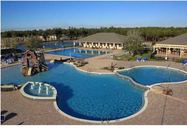 Beautifully wooded lot in a great location-walk to the wonderful amenities of Hammock Bay - the clubhouse, pools, fitness ctr! Priced to sell w/the CDD fee paid. LAKEFRONT w/exceptional views. Hammock Bay is located in a Community District Dev. HOA fee of $109/monthly. .05% maintenance fee.