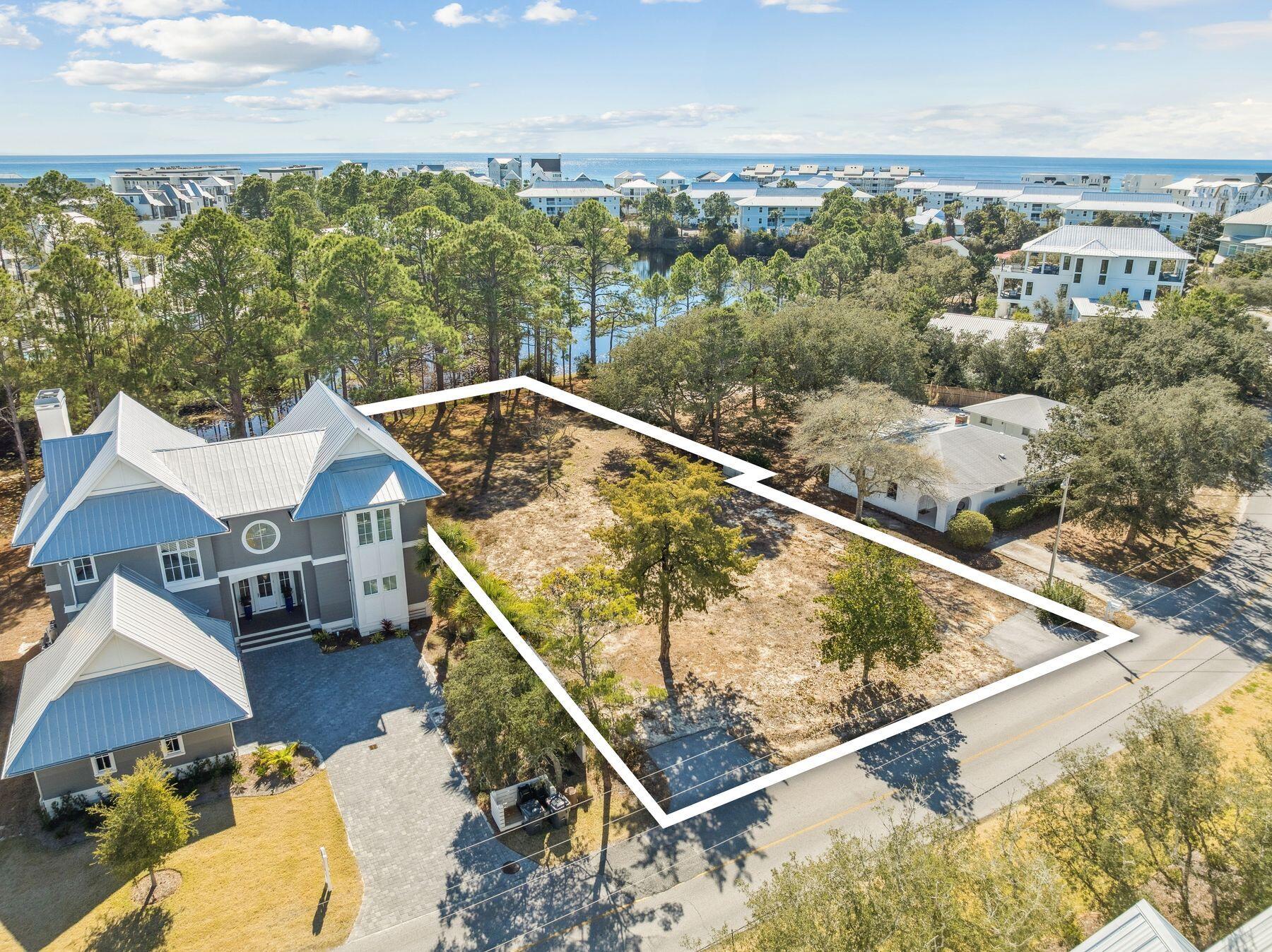 Tucked within the charming neighborhood of Eastern Lake Estates, south of Scenic Highway 30A and overlooking Tresca Lake, this homesite offers a rare opportunity to build in one of Seagrove Beach's most peaceful and naturally beautiful settings. Spanning approximately 0.3 acres with nearly 70 feet of frontage along a serene coastal lake, the lot enjoys tranquil views, added privacy, and a protected natural backdrop that enhances the sense of space and calm. Surrounded by a beautiful blend of mature trees, classic Old Florida charm, and stunning new construction, the setting perfectly captures the character that makes this pocket of Seagrove so desirable. With a generous footprint, there is ample room to design a custom residence with outdoor living, a pool, and thoughtful orientation toward the water and peaceful scenic views. Two public beach accesses are just a short stroll away, making it easy to enjoy the white sand, emerald waters, and the rare serenity of Eastern Lakeone of 30A's treasured coastal dune lakes known for paddleboarding, kayaking, fishing, and its unique connection to the Gulf. Just nearby, Eastern Lake's county park offers a boat launch and dock for small motorized boats, kayaks, and paddleboards, providing effortless access to the lake from both the park and the beach. With no HOA and popular local favorites like Old Florida Fish House, Beachy Bean Coffee Co., and The Big Chill all close by, this homesite combines natural beauty, convenience, and strong investment potential in an exceptional south-of-30A location.