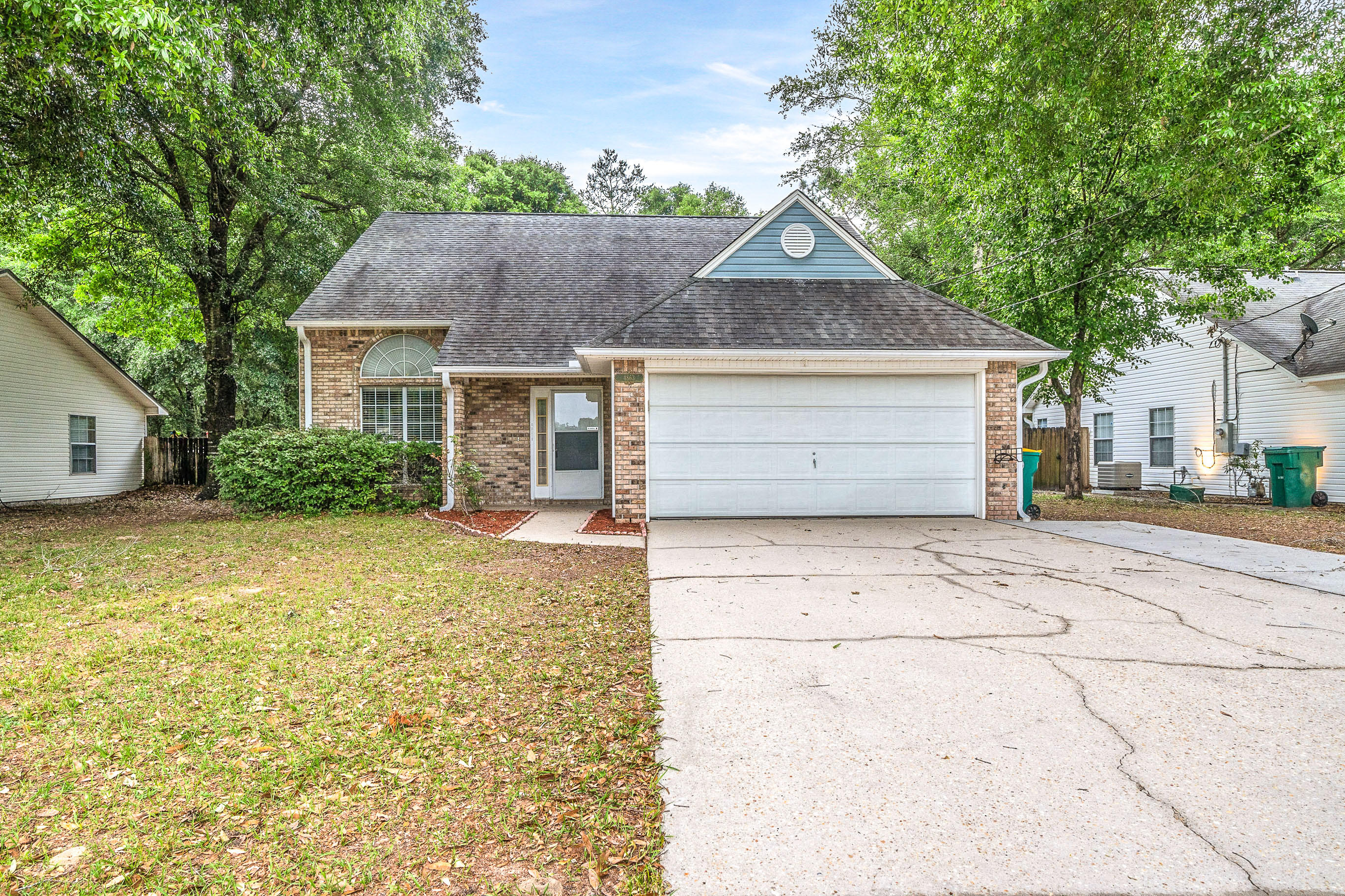 Check out this 4 Bed/2bath/2Car Garage home with LOW COUNTY TAXES situated South of I-10 with easy commute to 7th Group/Duke Field/Eglin AFB via Live Oak Church Rd. The home welcomes friends and guests alike with a high vaulted ceiling and cozy gas fireplace. The spacious kitchen features ample cabinet space and gas range with nice sized eat in kitchen over looking the peaceful nature views behind the property. The large master suite is located on the second floor with a walk in closet and large jetted tub. The additional bedrooms located on the first floor are nice sized with ample closet space. There is a screened in porch in the backyard perfect for entertaining or enjoying your morning coffee. The property is being offered with a 1 year home warranty for the buyers peace of mind
