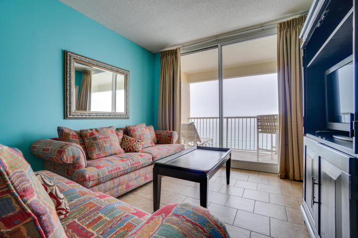 This one of a kind property conjures up images of sun-splashed days of swimming, biking, and relaxing. It lives like a beach house but comes with all the benefits of owning a condo. Hard surface flooring throughout and conveys with luxurious furnishings, window treatments, and artwork that welcome you to lie back, relax, and enjoy panoramic views of the pool, beach and ocean. Condo has 9'. Open floorplan and 9' ceilings allow for fabulous Gulf and sunset views from balcony, living room, dining room, kitchen, & master suite providing the ultimate alfresco living and entertaining environment! Sunset views from the generous, private, balcony are a perfect end to a sunny day and beginning to an exciting evening. MAIN MASTER SUITE is front and center on the beach