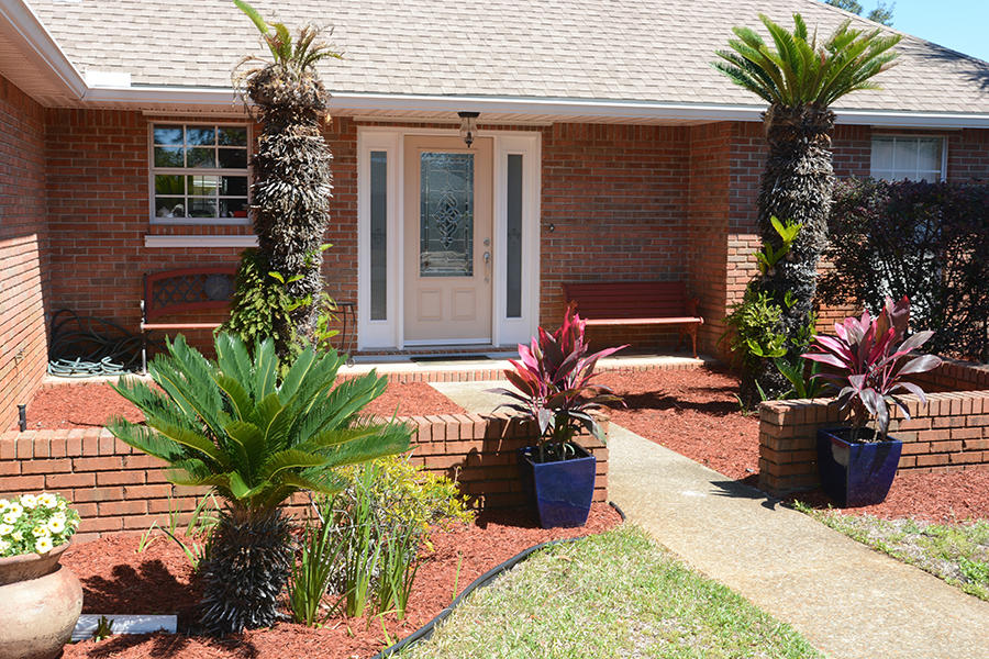 Deeded access to the beach. Beautiful home located in a very desirable neighborhood known as Emerald Estates Close to shopping, restaurants and Mid-bay Bridge. Home as an amazing lap pool and connecting whirlpool for those relaxing moments under the stars. Large open split bedroom floor plan with fire place. Beautiful hardwood flooring that is Teak imported from Brazil. Cathedral ceilings in living room and dining room. Large master bedroom with walk-in closet. Double car garage with pull down stairs and floored attic for storage. Open backyard patio and screened in back porch. Yard has new privacy fence and is nicely landscaped.