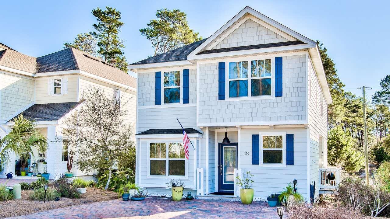*Seller Willing to Contribute Up to $15,000 toward Buyer Closing Costs for Interest Rate Buy Down* Conveniently located one mile from Rosemary Beach, a half mile to the beach and around the corner from shopping and dining options on 30Avenue, this 4 bed 3 bath beach house in the quiet 'Pinewood Preserve' neighborhood of 30A delivers designer furnishings, tasteful décor, and alfresco offerings. 180 Pinewood Lane is being offered fully furnished, with some owner exclusions, and is an affordable primary home option here on 30A. Better yet, short term rentals are allowed here with rental projections grossing over $80K annually. The main level features an open-concept layout along with a side courtyard, summoning you to entertain the evening away and enjoy some wonderful gulf breezes. You will even find a full bedroom and bathroom on this main level, perfect as a dedicated great guest suite OR your own home office. Up the stairs, the loft area greets you with a secondary living room and hangout space, along with two full bedrooms and a hallway bath with walk-in shower. The master suite is tucked away in the corner of the second floor, featuring plenty of privacy but also some wonderful pool views from the sitting area. The master bathroom has his-and-her sinks, and a lavish walk-in shower.