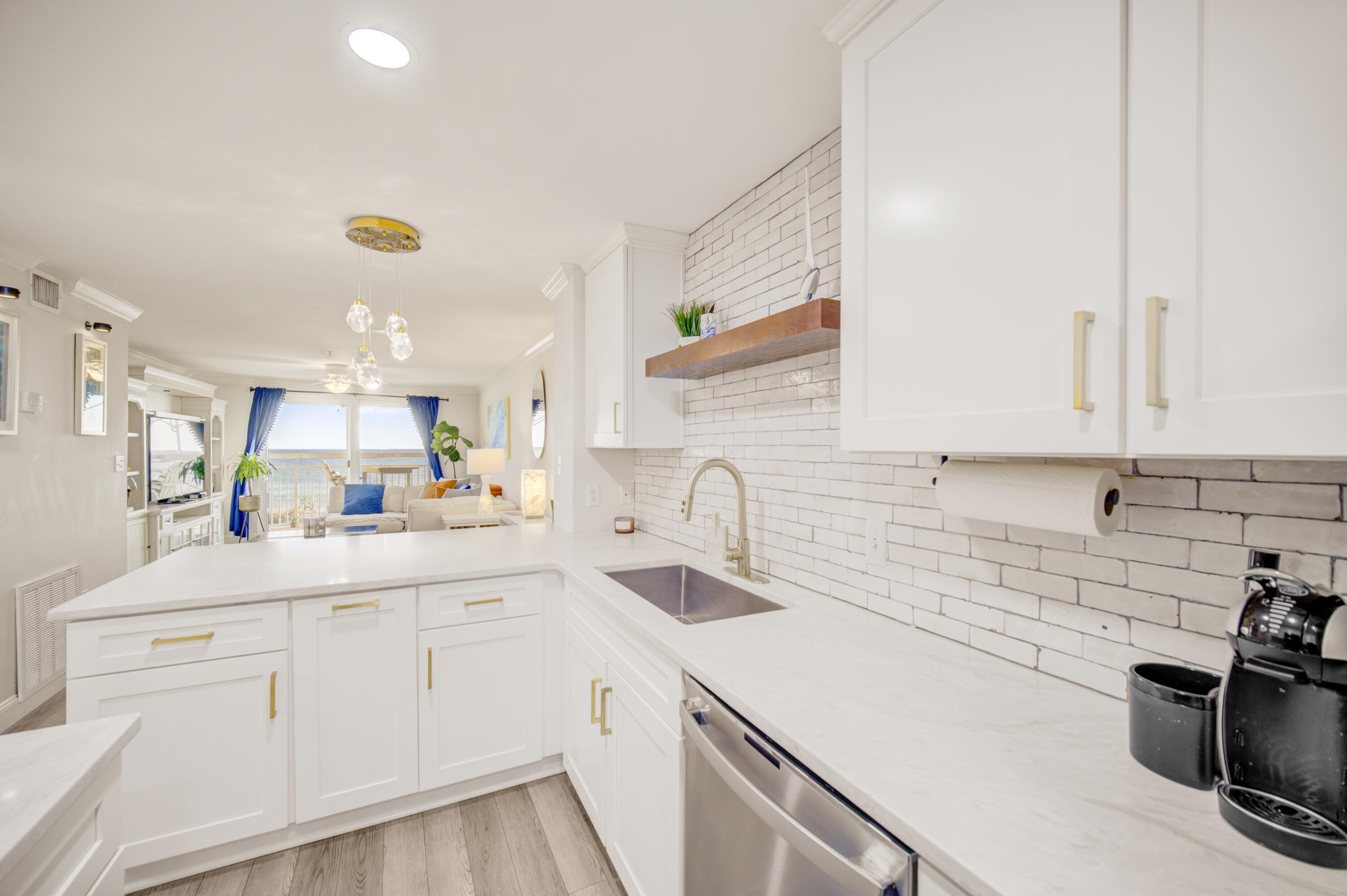 Experience elevated coastal living in this fully remodeled 2BR/2BA residence on prestigious Okaloosa Island. Situated within an exclusive boutique community of just 23 residences, this condo offers exceptional privacy, tranquility, and refined island living. The interior showcases modern finishes, sophisticated design elements, and a bright, open layout ideal for both entertaining and everyday comfort. Enjoy true peace of mind with significant building upgrades already completed, including a new roof (October 2025), new HVAC system (2023), and new water heater (2023). Previous major capital improvements have also been fully paid, including approximately $110,000 in 2021/2022 for premium upgrades such as windows, doors, and balcony enhancements, plus $28,000 for the roof replacement.
 Just steps from the sugar-white sands and emerald waters of the Gulf, this turnkey residence presents a rare opportunity to own a low-density luxury property in one of the Emerald Coast's most desirable island locations.