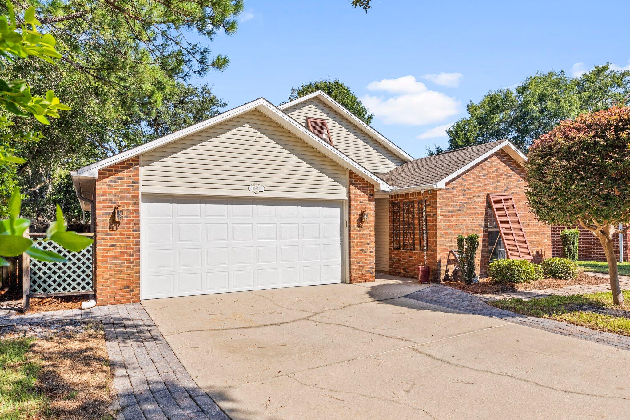 Bluewater Bay home convenient to Bluewater Bay Elementary, EOD school, shopping, and Destin. Home features tile, and brand new LVP floors throughout main and upper level making cleaning a breeze. Plenty of functional storage is offered with first floor built in drawers and cabinets. Rounding out the main level is the kitchen taking cooking to the next level with a gas stove, stainless major appliances, chef preferred stainless counters, and plenty of natural light emanating from the beautiful backyard. The second floor is highlighted by a large primary bedroom complete with its own ensuite bathroom and complimented by a double vanity and tiled shower. Take advantage of the large backyard patio, paved walkways, fire pit, and additional storage shed while you entertain or relax in the  thoughtfully landscaped backyard. Location and amenities make this property the perfect place to call home.