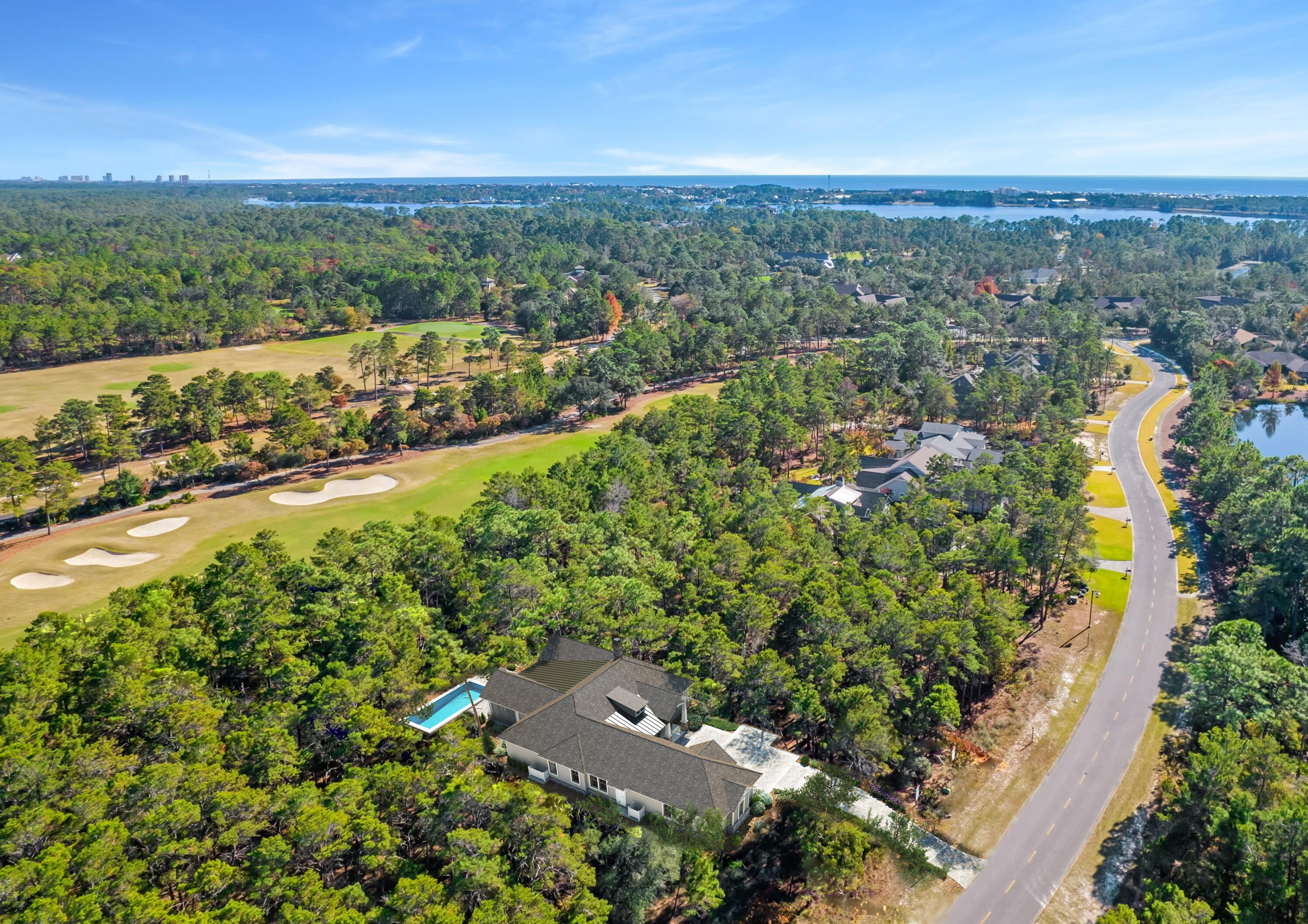 'Currently under contract taking back up contracts until 6/24'. Now is your opportunity for new construction on a high and dry lot in a superb location with peaceful views in coveted Wild Heron, built by notable custom builder and architect. Projected for completion by December 2022, this four-bed, three-and-a-half-bath home boasts more than 2,900 square feet of living space behind a brick/stone combination exterior. Situated on fairway 10 of Shark's Tooth Golf Course with superb views, this single-story, open-concept home is handicap ready and is replete with luxurious finishes including 12-ft. coffered ceilings in the living area; sliding doors that open to a large outdoor living space with pool, screened porch, summer kitchen and fireplace overlooking the golf course; hardwood flooring throughout; vaulted ceilings with exposed wood trusses in the owner's suite; a split floor plan; and, a separate office or media room with ship lap walls and book shelves. Enter the home through a solid mahogany Tiffany front door into the foyer with beautiful cross wood beamed ceiling and shiplap walls. The kitchen is well-conceived for entertaining with a butlers pantry, wet bar, quartzite counters, two large islands as well as Bertazzoni stainless appliances, double oven and a six-burner gas stovetop. Other notable updates include indoor and outdoor fireplace, Andersen windows, a tankless water heater and an attached two-car garage with additional golf cart garage and two outlets for an electric vehicle and golf cart and wheel chair accessibility in and throughout the home. Residents of Wild Heron enjoy plentiful neighborhood amenities including access to two docks with water toy-stocked boathouse on Lake Powell, pool, hot tub, fitness center and walking and biking trails that meander through the neighborhood. Memberships to the golf club and tennis center are also available for purchase. Wild Heron is surrounded by a 732-acre coastal sanctuary, making it a peaceful retreat for homeowners while being just a few minutes from the beach and Pier Park and 10 minutes from the shopping and dining on Scenic Highway 30A.  Get in on this home today and pick your finishes before it's too late with your very own interior designer at no extra fee.
 
Disclaimer: These drawings are conceptual only and are for the convenience of reference and are subject to change. They should not be relied upon as representations, express or implied, of the final detail of the property. Details shown are examples of proposed finishes and may not depict actual finishes.  All depictions of appliances, electrical fixtures, plumbing fixtures, equipment, counters, soffits, floor coverings and other matters of detail are conceptual only.  Actual views may vary and cannot be guaranteed. Views shown cannot be relied upon as the actual view from any particular direction. Improvements, landscaping and amenities depicted may not exist.
