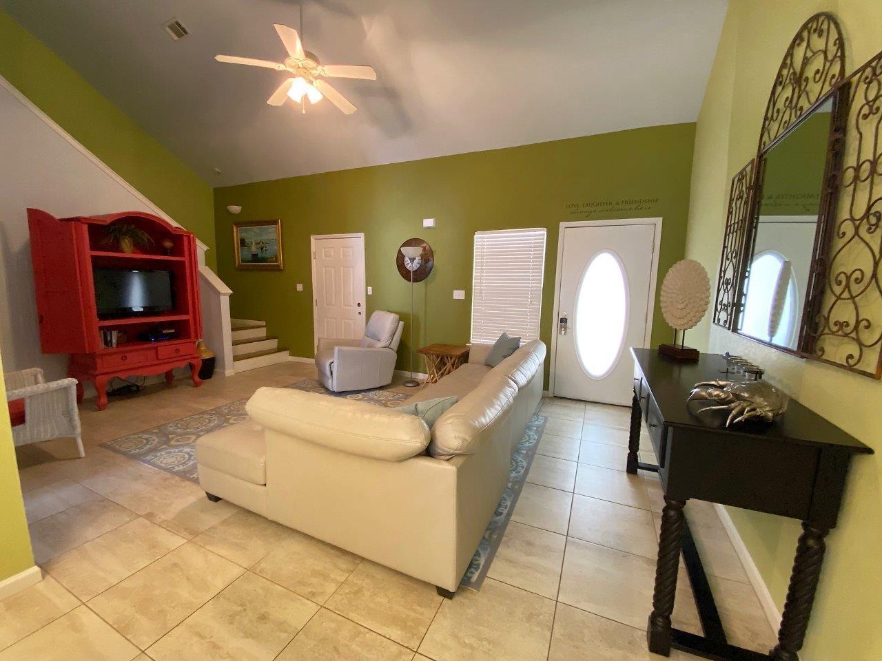 Move in ready 3 bedroom 2 bath in prime Destin location! Open concept main level with primary bedroom and full bath and large owners closet that could be used as a mini office. Walk up the beautiful hardwood stairs with small flex space on landing, 2 additional bedrooms and full bath. Large closets in every room. The one car garage has new coating, park your car or set up a ping pong table instead!  Just a few steps to the community pool. Includes all appliances except the refrig in the garage. NO SHORT TERM RENTALS.