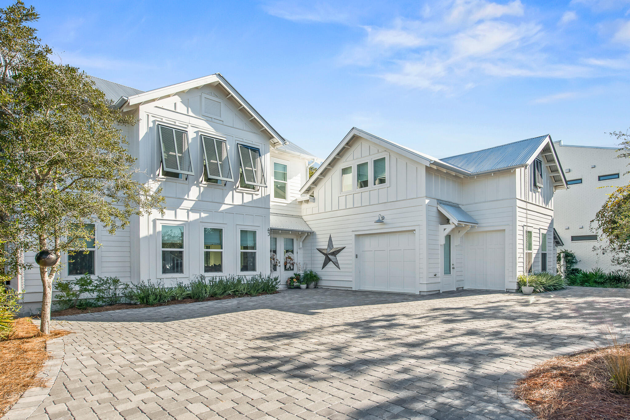 Welcome to 43 Suzanne Drive, ideally located in the heart of Seagrove Beach and just a short stroll to Seaside, this home features fantastic privacy while also boasting quick access to 30A amenities! This newly-constructed beach home is furnished (excluding a few items) and turn-key. Also, 43 Suzanne Drive features 5 bedrooms, 5 bathrooms, 2,759 square feet, designer furnishings, high end appliances, an open floor plan with a large chef's kitchen, and a screened in porch that encompasses serenity and relaxation. This light and airy home is designed for large family gatherings, and the well-planned floor-plan showcases that, making it an inviting experience for the entire group. 

43 Suzanne Drive also features a large open-concept living space with chef's kitchen, 2 master suites, a large laundry room, and a spacious screen-in back porch. The separate apartment space, right off the garage, offers a kitchenette, fridge, and a full bathroom. No detail was spared in this beautiful home, with hand-scraped wood flooring throughout, a large wood-burning fireplace, marble countertops, custom-built bunk beds, and professionally selected fixtures. Because the large homesite is bordered by a conservation area, this creates the ultimate privacy with plenty of parking for all your family and friends! Do not hesitate to schedule your showing today with this gem of Seagrove Beach!