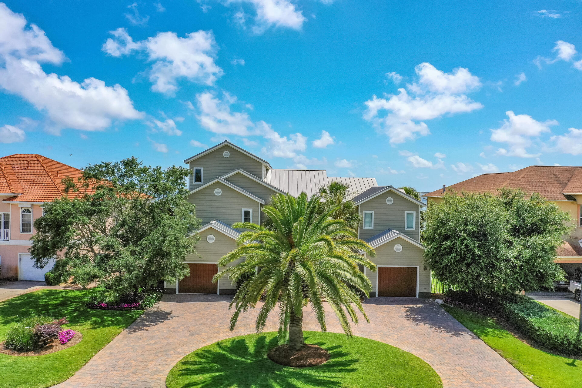 Stunning views+pristine landscaping+sparkling pool+spacious indoor/outdoor living mean there's truly no place like THIS home! Designed by architect James Dowling and meticulously-kept by the original owner, this waterfront masterpiece features attention to EVERY detail! Gunite/saltwater pool adjoins the outdoor living area with access to the 1st floor game room, wet bar, half bath and elevator. The 2nd floor heart of the home showcases water views from the open kitchen/dining and living area. Proximity of guest rooms allows easy access to downstairs and the pool, while the master suite enjoys separated privacy on the 3rd floor. Two NEW HVAC units, 2-year old Rinnai tankless water heater, metal roof, Hardie board siding and composite deck promise minimal maintenance. This is THE ONE!