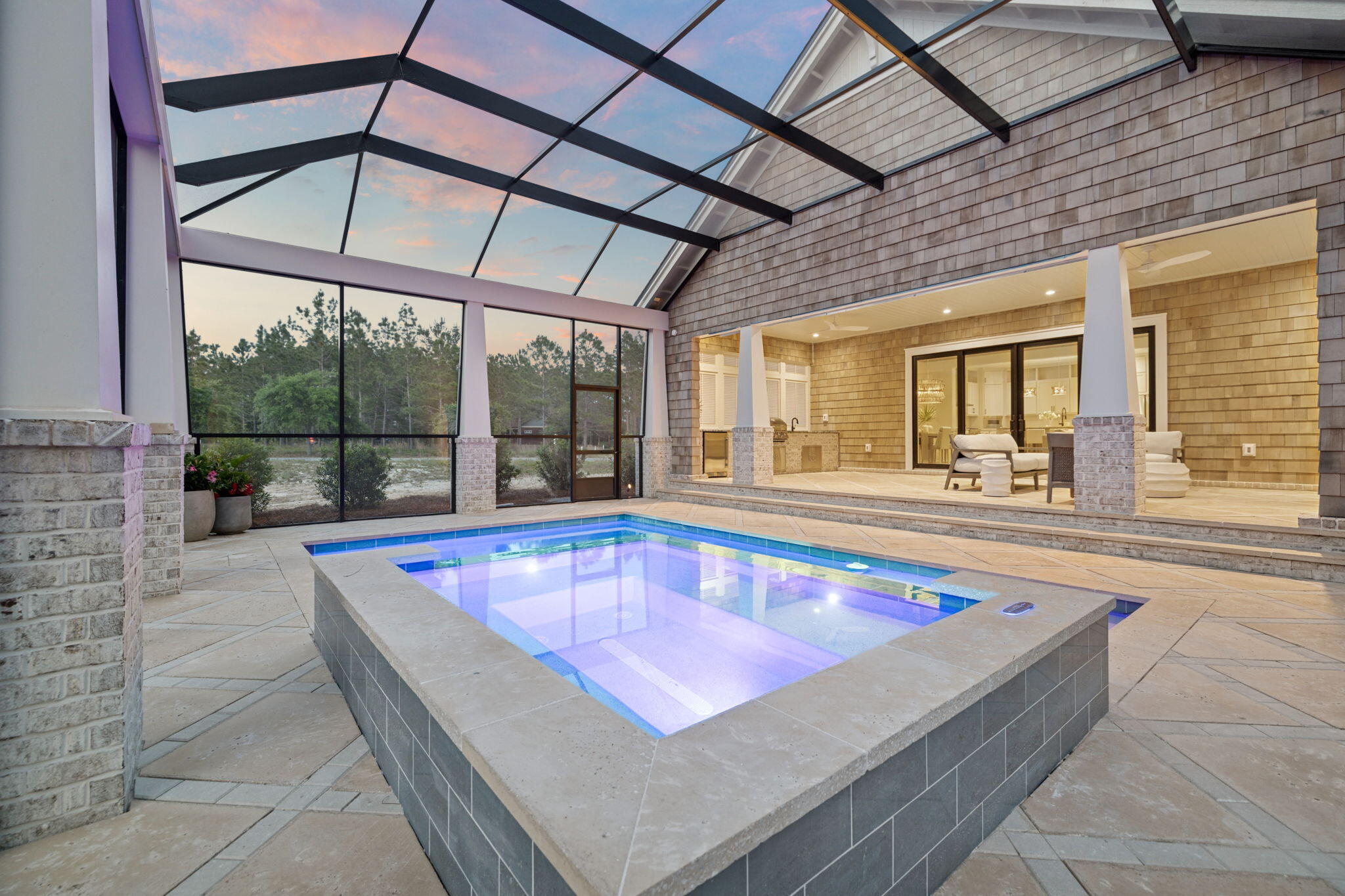 Situated on a beautifully landscaped homesite in the gated community of Wild Heron, this new construction home offers 2,785 square feet of heated/cooled living space and 4,963 square feet under roof, with a private pool, screened-in lanai, and refined finishes throughout. Thoughtfully designed for both everyday living and entertaining, the home includes 10' ceilings on the first floor, vaulted cypress wood ceilings in the living room and primary suite, and an open-concept layout filled with natural light.

Built by Focus Construction and designed by Coastal Architects, this custom residence showcases exceptional craftsmanship and attention to detail. Interior features include solid core doors, floating bathroom vanities with under-cabinet lighting, Delta black plumbing fixtures black accent hardware, and custom shaker cabinetry. The chef's kitchen is outfitted with premium Thermador appliances and seamlessly connects to the main living and dining areas.

The spacious primary suite offers a tranquil retreat with vaulted ceilings, a walk-in closet, and a beautifully appointed en-suite bath. Additional highlights include a large covered entry with brick detail, real cedar shake siding, exterior gas lanterns, and a massive two-car garage with extra storage space.

Step outside to your private oasis: a screened-in pool enclosure with a heated pool and hot tub, covered lanai with gas fireplace, outdoor kitchen, and custom louvered millworkall surrounded by a peacock paver pool deck and lush landscaping with low-voltage lighting.

Wild Heron is a 734-acre gated neighborhood located on the shores of Lake Powell, Florida's largest coastal dune lake. Residents enjoy access to top-tier amenities including a community dock, fitness center, resort-style pool, boathouse, and Shark's Tooth Golf Club membership optional. For water enthusiasts, property owners can lease long-term, low-profile boat slips with power liftsdesigned for vessels up to 24 feet subject to availability. Whether you're into paddleboarding, wake surfing, or a sunset cruise, Lake Powell is just steps away.

This home offers the perfect combination of luxury, comfort, and access to one of the Emerald Coast's most scenic and well-appointed communities.