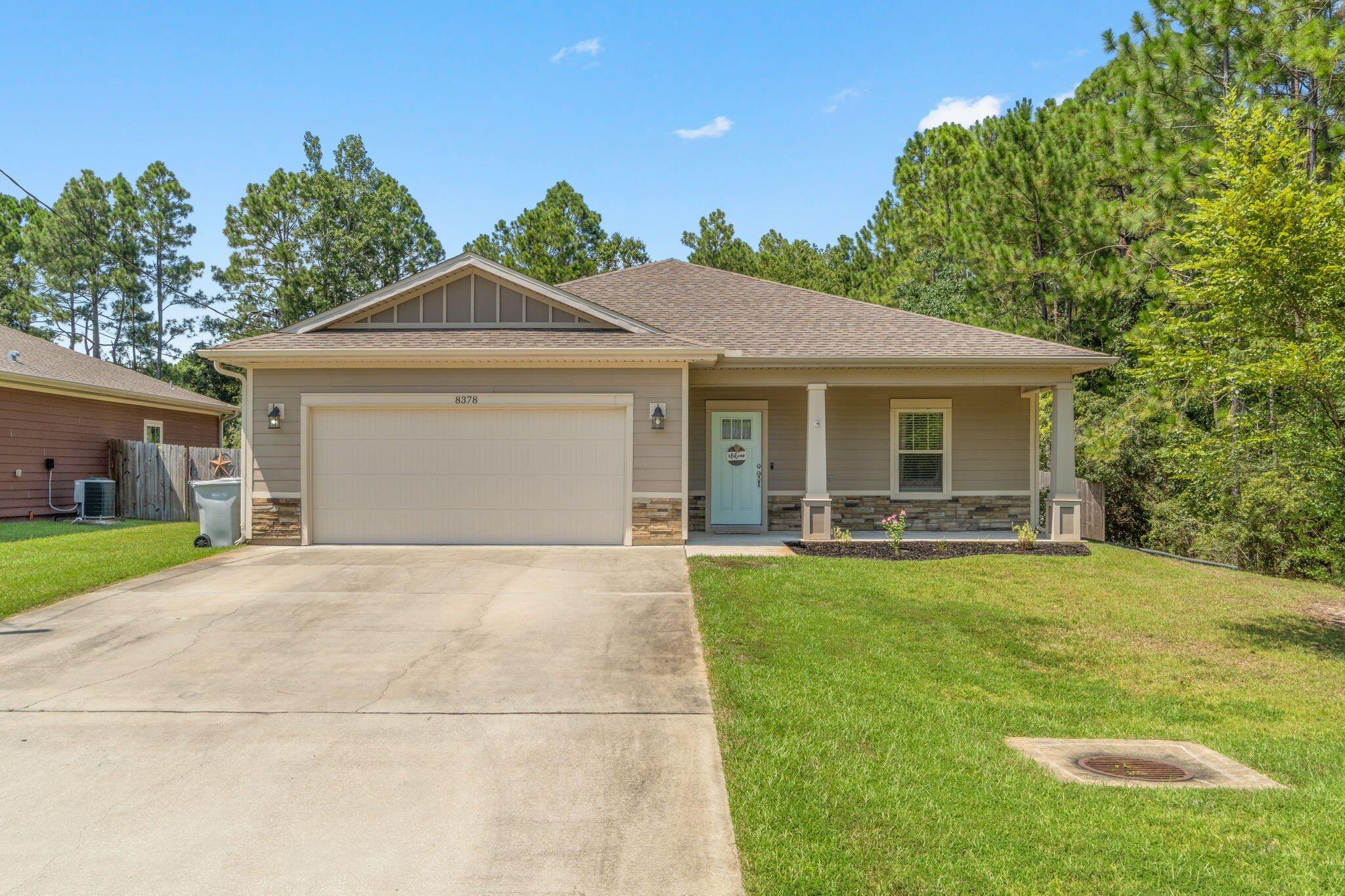 Like new with no HOA! Welcome home to this stunning craftsman style Ramsey & Walker built home that's only 6 years young featuring 3 bedrooms and 2 baths. Located at the end of a quiet dead end street and a quick drive to Hurlburt Field, you'll love the privacy of this property while also being only minutes to Navarre's beautiful beaches. Pull up the driveway in front of the two car garage and walk to the front door where you'll find an adorable covered front porch inviting you in. Through the threshold a long open entryway will greet you with a trey ceiling accented with crown molding and a front entry closet. The open floor plan awaits you with a large living space adorned with hard surface flooring open to the stunning kitchen. Stocked with all the updated features you're looking for, you'll love the custom tall cabinets with tasteful hardware, the granite counters, the large island with plenty of room for seating, the stainless steel appliances, drop down pendant lighting, and the spacious pantry. Off the kitchen is the dining room featuring another trey ceiling, and the back door leads outside to the large fenced in updated backyard complete with a sprinkler system, playground, seamless gutters, and a property line that extends far past the fence! You'll love the extended patio space with sunshades and just imagine the nights sitting around the fire pit enjoying the quiet or entertaining with family and friends! Back inside the split floor plan features bedrooms on either side of transom windows which provides a nice high end custom touch. The master bedroom is a fantastic and spacious retreat with a trey ceiling and crown molding and a master bathroom with gorgeous granite double vanities, a tiled shower with soaking tub, and a massive walk in closet! The other two bedrooms on the other side of the home are nice sized with ample closet space, and a beautiful bathroom with matching finishes between them along with a hall closet. The interior laundry room has the same tiled floor as the bathrooms and leads to the garage. Bring your electric car! In the garage features a plug in for your electric car as well as pull down attic space for additional storage. You're minutes from Navarre Beach, Navarre High School, the YMCA, Navarre Youth Sports Association, as well as dog parks and walking paths. Don't delay in making this your perfect retreat for a primary residence or investment property.