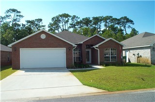 Beautiful, like new home just a within walking distance to the Sound! Tile floors and carpeting throughout; split bedroom plan; stainless appliances in kitchen; fireplace in living room; lawn pump and sprinkler system for an easy way to maintain your yard. Available September 12.