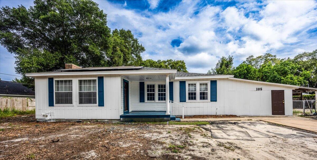 Come see this charming Florida cottage ready to move in. This home offers 3 bedrooms, 2 bathrooms, and 1,572 sq ft of comfortable living space with a host of recent upgrades. Enjoy peace of mind with a new HVAC (2025), water heater (2024), roof (2022), new copper wiring throughout (2021), remodeled bathrooms (2025). Fresh interior and exterior paint (2024) and new laminate flooring throughout create a bright, modern feel.
Step onto the inviting covered front porch and into a spacious living/dining area filled with natural light. The functional layout is perfect for both everyday living and entertaining. Ideally situated just minutes from popular restaurants, shopping centers, fitness facilities, parks, military bases Hurlburt and Eglin, and the Emerald Coast's crystal-clear beaches