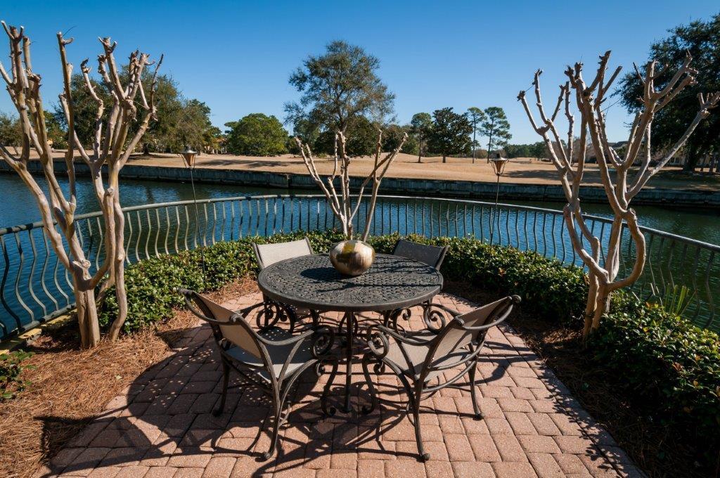 Turn-key property priced to sell! Three bedroom, three bath home with a 2-car garage on one floor. Property has an open living-dining-kitchen area with views to the lake and eighth fairway on Baytowne Golf Course. Numerous desirable features include Jennaire gas cooktop and fireplace, wood flooring in bedrooms ('16), stainless steel appliances ('17), and A/C replaced ('15), quartz countertops and subway tile backsplash. Screened porch runs across back of the home and has beautiful, expansive views of the lake and golf course. Shows like a model! Home is sold furnished. Fountains fees are $395/mo. Sandestin fees are $362.75/qtr. (Buyer to confirm all information, fees, and measurements.)