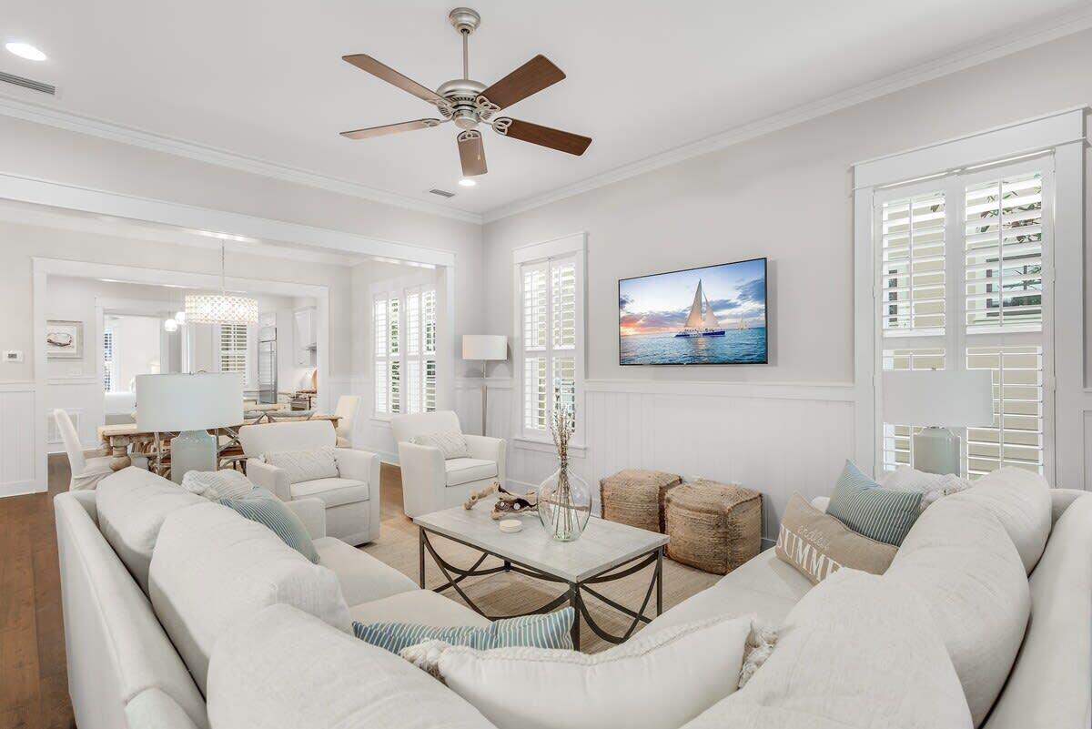 Step into this gorgeous 4-bedroom, 3.5-bath home  with two luxurious primary king suites, one on each floor, and be prepared to fall in love. This newer 2012 Huff Cottage radiates charm and warmth from the moment you walk through the door. Every inch of this home reflects impeccable care and attention, with its beautifully decorated interior, featuring newer furnishings and custom designer lighting that create a light, inviting ambiance.Positioned in a premier location in WaterColor phase 4 on Sunflower Street, this home faces a serene park, offering beautiful views and peaceful surroundings. 2 homes off E Royal Fern (meaning less traffic and more privacy), you're still less than a block away from the enchanting Dragonfly Pool—a perfect spot for relaxation and fun. Imagine preparing meals in a chef's kitchen outfitted with top-of-the-line GE Monogram appliances and a breakfast bar with seating for 4 perfect for both intimate dinners and lively gatherings with family and friends. Adjacent, an updated bar area with a wine cooler awaits your favorite bottles, perfect for unwinding at the end of the day or toasting to life's special moments. The home's thoughtful layout offers two luxurious primary king suites, one on each floor, ensuring comfort and privacy for everyone. Whether you prefer the convenience of the first floor or the peaceful retreat upstairs, you'll love having your own private sanctuary. Upstairs, you'll also find an en-suite guest bedroom with two queen beds, perfect for hosting friends or family in style, as well as a bunk bedroom that brings an element of fun and functionality for children or additional guests. The nearby flex space offers even more possibilities, whether you envision a cozy den, a vibrant playroom, or additional sleeping quarters. As you explore, you'll notice the countless thoughtful upgrades, including brand new air conditioners installed in 2022, ensuring year-round comfort. Every detail of this home has been lovingly maintained, leaving you with nothing to do but move in and enjoy. If you are wanting to maximize rental income, this home sleeps more guests than other similar 4 bedroom homes because the larger upstairs bedroom has 2 queen beds and there is the additional pull out sofa in the 2nd floor living area making the number of people who can sleep in the home 12 (this home also has 12 wristbands for access to WaterColor amenities). Included in the HOA dues owners and guests have access to all the world class amenities of WaterColor including the Watercolor Beach Club, a stunning gulf-front club that offers everything you need for a luxurious beach day. It features three pools, three restaurants, and multiple floors of seating with unobstructed views of the Gulf. Watercolor also has its own private beach providing an exclusive seaside experience. At Camp Watercolor, you can enjoy a lazy river, as well as two additional pools with water slides for extra fun. The camp includes a restaurant and bar, and it overlooks a large green space perfect for soccer or other outdoor activities.In addition to these, the Watercolor community boasts three more pools throughout the area. For tennis enthusiasts, Watercolor Tennis offers five clay courts and two pickle ball courts along with a pro shop and daily clinics and lessons.Watercolor is also home to the Boathouse located on Western Lake, a rare coastal dune lake, offering fitness classes and kayak, paddle board, and foil board rentals for outdoor water activities.