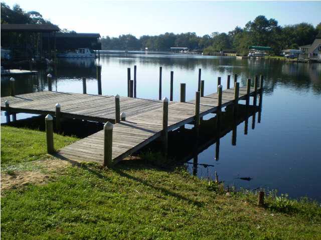 NICE AND SPACIOUS 2 STORY TOWNHOME. ENJOY THE COZY, WOOD BURNING FIREPLACE WITH A BRACK FACING; LARGE KITCHEN TO INCLUDE PLENTY OF CABINET & COUNTER SPACE WITH BREAKFAST BAR; BOTH BEDROOMS HAVE PLENTY OF ROOM AND CLOSET SPACE; MASTER BEDROOM HAS WALK-IN CLOSET. COMPLEX IS LOCATED ON SERENCE CINCO BAYOU AND HAS A GREAT DOCK TO FISH FROM OR DOCK YOUR BOAT DURING THE DAY. AVAILABLE NOW.
