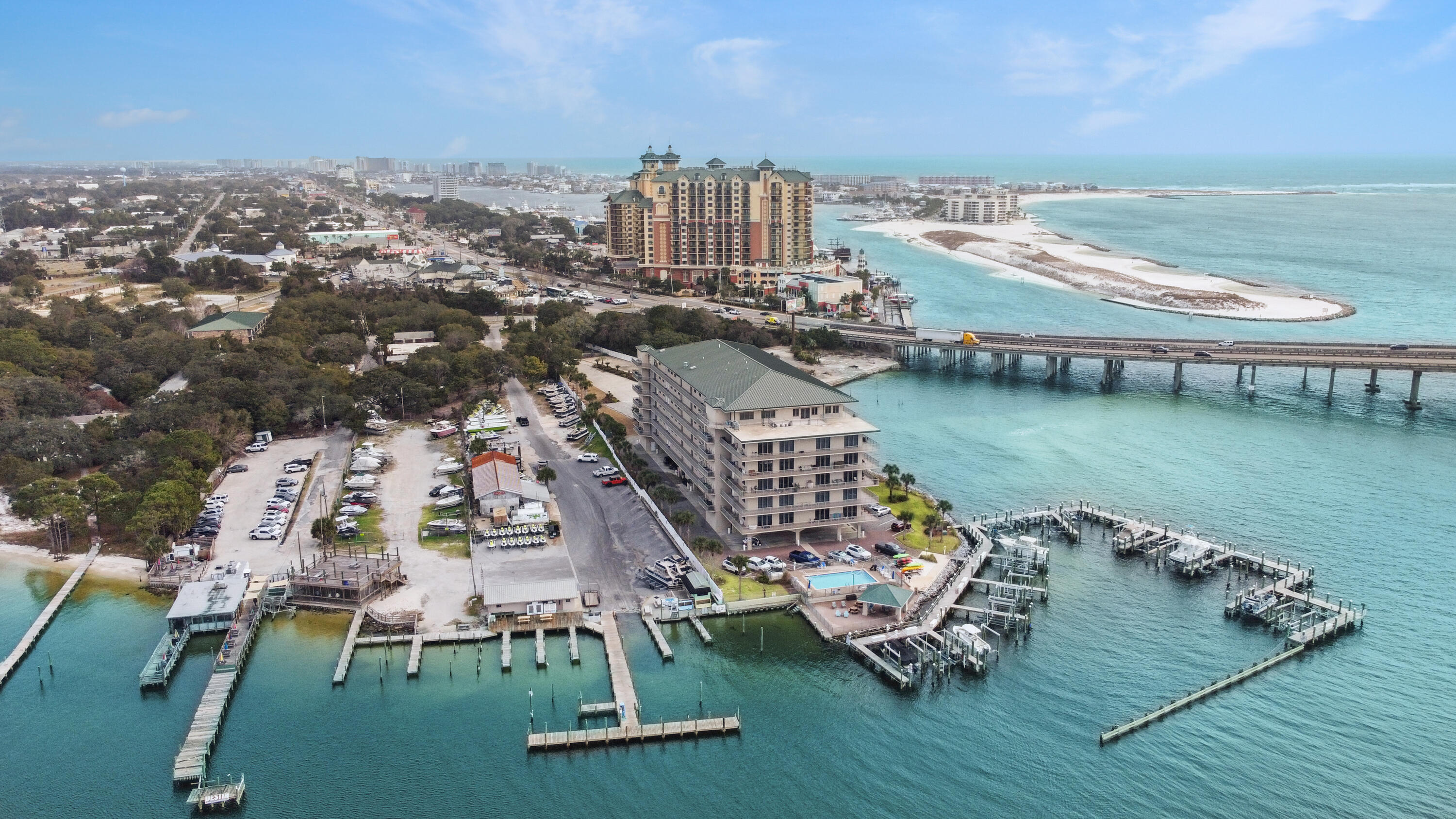 Romantic sunsets and cheerful dolphins, play strong on your heart strings! Best location to enjoy the Emerald Coast Florida lifestyle! Westernmost edge of Moreno Point offering postcard iconic views of the Harbor entrance & Norriego Point, the entire East Pass, the dunes of western Okaloosa Island, Crab Island & Choctawhatchee Bay. Walkability to HarborWalk & other west-Destin attractions. Mature, manicured grounds, gated entry, elevated pool deck and bay-front gazebo make for elegance, privacy and sophistication. Live comfortably & entertain spectacularly in 2,038 sf under 10 ft. ceilings. Spacious gourmet kitchen with granite, stainless, stainless, breakfast bar, double ovens, wine cooler and upgraded cabinetry overlooking the open dining/living floor plan. Floor plan maximizes water views from all angles! Wake Up to the delightful open ocean views! Right from your master bedroom! Hurry today and book your personal viewing of this new modern condo for you!!! There is also a convenient owners storage room on the unit floor near the elevator! Parking spot is perfectly located 2 spots away from the lobby to the right as you enter #32.