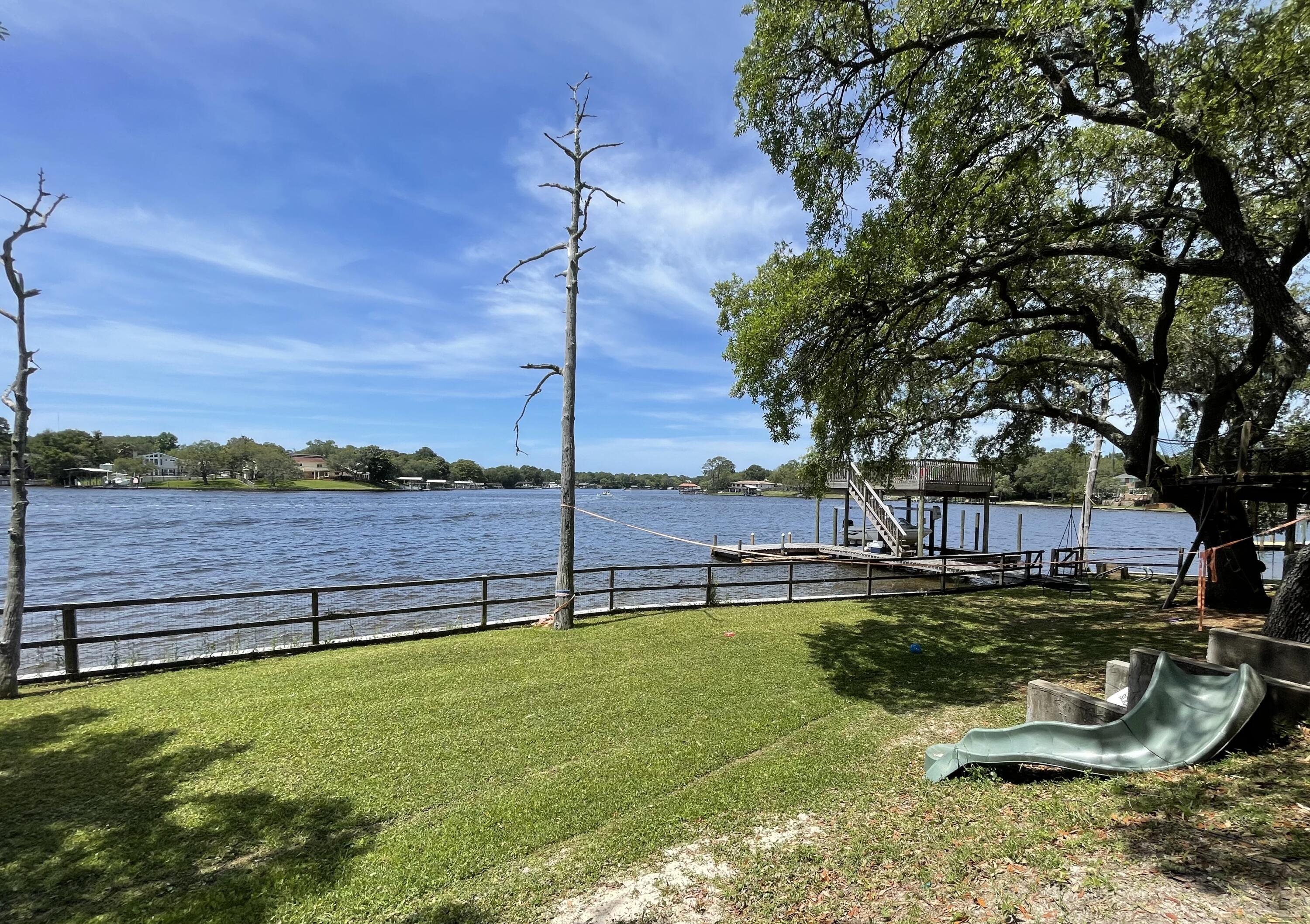 Lovely, Spacious, and Private! Furnished Guest house on Cinco Bayou. Surrounded by trees and views of the water. Very open floorplan with high ceilings and lots of natural light. Access to private dock. Apartment is the top floor over detached garage (not included). Must have great credit, no pets, and definitely no smoking.