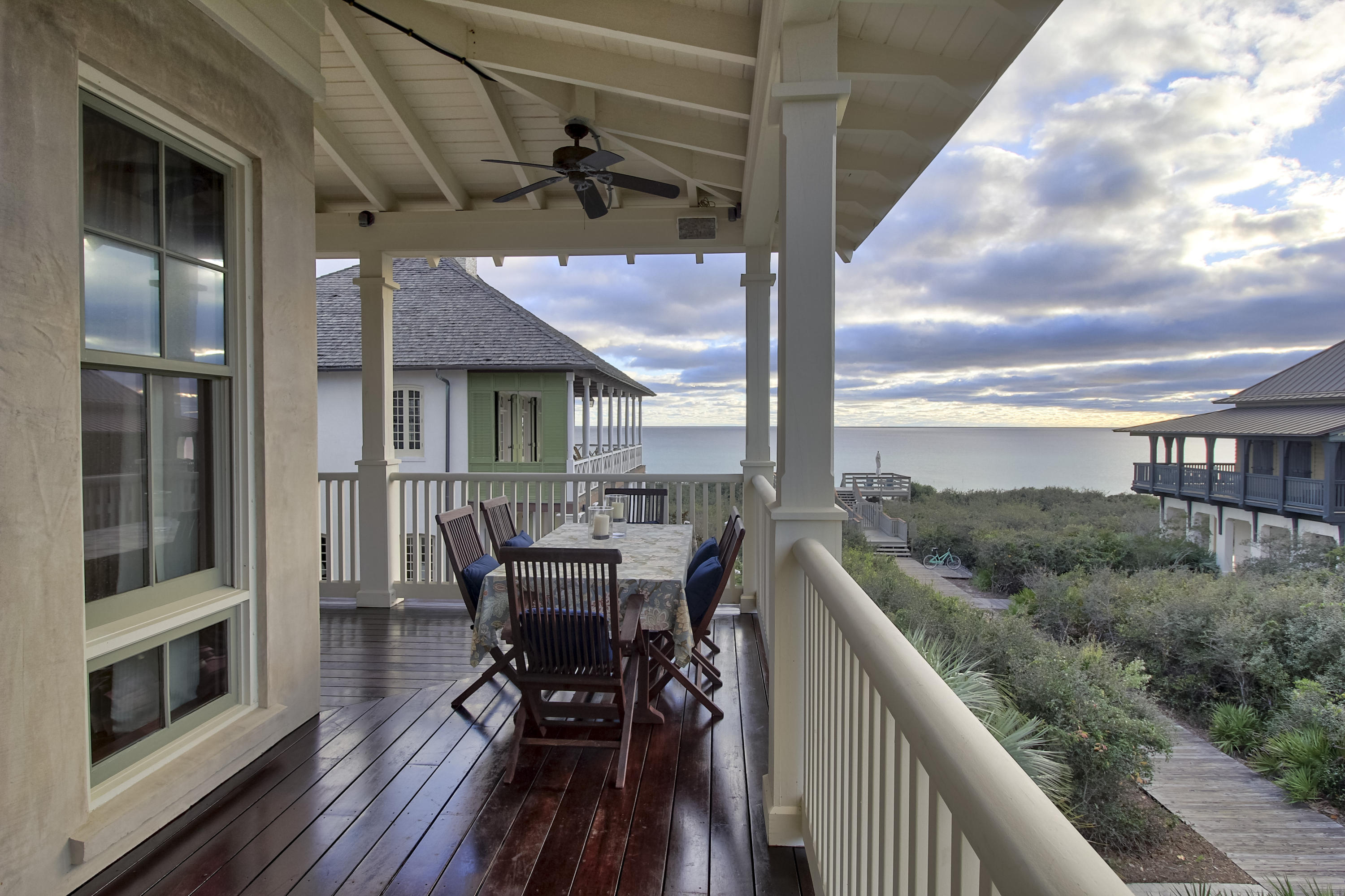 This remarkable home was designed by a talented team of professionals to fulfill the dreams of a family home where memories are made and traditions created. It is specifically crafted to accommodate 16-20 people but perfect for a quiet family get away. The owners insisted on a beach home that took advantage of the beautiful gulf views yet protected the home from stormy weather. This meant having the prime location in Rosemary Beach. GRAND ENTRANCE When you enter the grand foyer with 12 foot ceilings, you have an immediate feeling of quality with no detail left unturned. There are 3 bedrooms located on the first floor, an elevator, laundry room and private back entrance that leads to the outdoor shower and charming courtyard. The beautifully styled master suite presents 12 foot ceilings and 4 sets of French doors leading onto the veranda. His and her master bath hosts imported beveled limestone tiles, a luxurious LeFroy Brooks bathtub, spa shower and separate closets. This is a perfect private sanctuary for the owners. Reminiscent of a ship's quarters, the second bedroom has handcrafted Spanish cedar built-in bunk beds and closets. The en suite bathroom has glazed terra cotta tiles and teak countertops. The third bedroom has the same beautiful high ceilings with an en suite bath with blue and white custom tile. The oversized laundry room includes 2 washing machines and dryers, a drip closet, lots of storage and a built in stainless steel sink. The back entrance is perfect for all beach necessities and the outdoor shower. It leads to a large porch that opens onto a beautiful courtyard with palm trees and a fountain. LIVING LARGE Upon entering the main living area you are captivated by the incredible view of the turquoise gulf waters. WOW!!! There is space for EVERYONE! The double living area with new fresh white furnishings is anchored by Brazilian cherry wood floors, a grand cast stone fireplace and game-room. French doors open onto the wrap around deck - a perfect area for relaxing and dining outside. The adjoining dining and kitchen are fit for a chef! The kitchen is appointed with Siematic cabinets, 6 burner Wolf range, Wolf ovens, Dacor warming drawer, Miele steamer, Bosch dishwasher, Subzero refrigerator, 2 stainless steel sinks and a second built-in oven. The pantry has incredible storage and an icemaker. The butler's pantry includes a mini fridge and a wine cooler. Nearby is a multi-purpose room , a glass tiled powder room and a guest bedroom with an en suite bathroom. A ROOM WITH A VIEW! The third floor is a guest suite designed to accommodate an entire family. It has beautiful gulf views, a large living area, a bedroom that will sleep 4 or more and a bath featuring limestone floors and shower. Located on this floor is the wine closet and extra storage. THE ROYAL TREATMENT The 400 square foot carriage house is a private retreat as beautifully appointed as the main home. This fully functional space has a vaulted ceiling with designated sleeping, dining, kitchen and bathroom areas. A Subzero refrigerator, Dacor range, Meile microwave, Asko dishwasher make a designer kitchen. The EL Hombre custom clay tile adds the perfect compliment to the adjoining bathroom. NEW STANDING SEAM METAL ROOF INSTALLED MARCH 2018.  The FINISHING TOUCH Your Family !  Information contained within this listing such as square footage, is deemed to be accurate but is not guaranteed. Buyer to verify.
