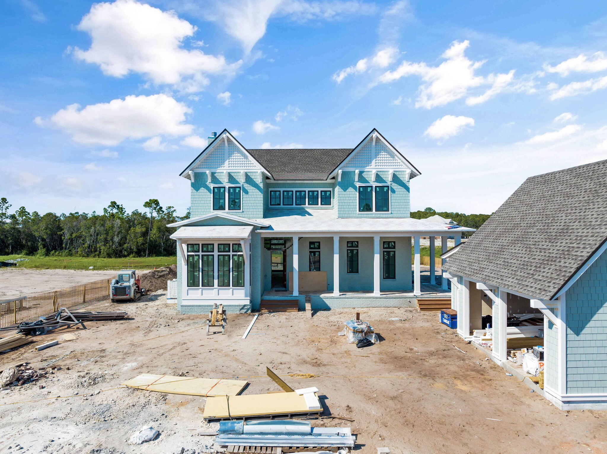Prominently positioned behind the private gates of Camp Creek, 410 Golfridge Drive presents a compelling new construction opportunity nearing completion. Configured by the talented team at Allison Ramsey Architects, the thoughtfully designed floorplan encompasses over 3,300 square feet of living space spanning two distinct levels. 

Upon initial approach, the welcoming covered porch leads way to the entry foyer and main living areas. Meticulously crafted to offer a perfect blend of contemporary design, comfort, and functionality, the living, dining, and kitchen areas are seamlessly connected and ready for entertaining. 
 Blurring the lines between indoors and out, the bi-fold doors provide access to the backyard oasis with private pool, screened living and dining porch with fireplace, outdoor kitchen, and pool bathroom. 

Overflowing with natural light, the first-level main suite features a spacious walk-in wardrobe and sumptuous ensuite. A powder room, laundry room with dedicated entry, and a two-car garage complete the first level. 

Occupying nearly half of the upper-level footprint, the grand suite boasts soaring vaulted ceilings, dual walk-in wardrobes, a sitting area, private balcony, and a fully equipped en-suite with custom tiled wet room, soaking tub, dual vanity, and enclosed water closet. Three additional bedroom suites, one of which is configured as a bunk room, are also found on the second level. 

Perfectly situated between Scenic Highway 30A and Highway 98, the WaterSound Camp Creek community offers convenient access to the iconic town centers of Alys and Rosemary Beach along with the culmination of world-class dining and entertainment options 30A has to offer. The rental restricted community also enjoys exclusive access to the newly constructed amenity center featuring dual pools, lazy river, pickle ball courts, tennis courts, a wellness center, and an on-site restaurant.

Located directly across Highway 98, the WaterSound Town Center hosts events like a weekly Farmer's Market and encompasses a Publix, restaurants, a STEAM school learning campus, and medical offices. Inquire today to learn more and discover why WaterSound Camp Creek remains one of the most sought-after ownership opportunities along 30A for full-time and second home residents alike.