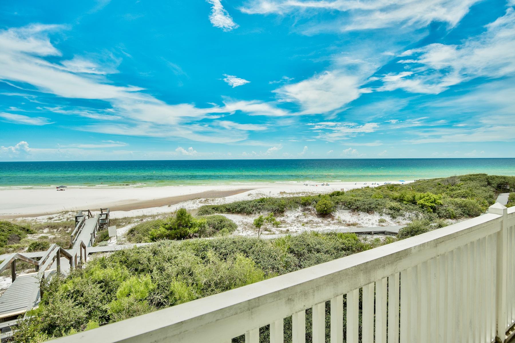 Experience unparalleled vistas from this premiere gulf front retreat ideally situated on an oversized 70 x 240' lot prominently positioned at an exceptional elevation to capture 180 degree views over the Gulf of Mexico and Draper Lake. This pristine residence has been masterfully designed with a spacious open floorpan comprised of over 4,600 sqft, offering five bedroom suites each accompanied by a private ensuite bath for optimal comfort. The primary living area was thoughtfully located on the second level taking full advantage of premier gulf views and highlighted with professionally curated interiors by Atlanta based designer Todd Bienz. The first floor entry level is complete with a secondary living room and full guest suite as well as elevator access, well equipped mud room and adjoining laundry room. The second level offers expansive living framed by multiple sets of French doors that lead to an expansive beach view deck, allowing ample natural light to flood the space as well as endless gulf vistas. The chef's kitchen is open to the main living area and offers custom cabinetry, granite countertops, stainless appliances including a gas range as well as a full sized wet bar. The second level also features a master bedroom suite, complete with a sitting area and ensuite bath as well as access to the expansive south facing porch; two additional guest suites are located on the second level each positioned for optimal privacy and characterized by vaulted ceilings. The third floor master suite is accessible by both a formal staircase and private elevator offering an expansive sitting area indoor and outdoor on the private veranda as well as floor to ceiling glass windows that frame the most exceptional views over the Gulf of Mexico and juxtaposed coastal dune lake. The master suite offers an equally impressive ensuite bathroom complete with a soaking tub, wet bar, walk in shower, dual walk-in closets, dual vanities with ample storage as well as a spacious sitting area overlooking the endless gulf views. Exceptional architectural elements highlight the exterior facade including an oversized wrap around porch as well as ample parking and an oversized garage. Old Florida Beach is a private, gated community situated on the West end of 30A offering a newly built community pool area and adjoining clubhouse and located close to world class restaurants including Shunk Gulley Oyster House as well as outstanding shopping, local entertainment and world class golfing.