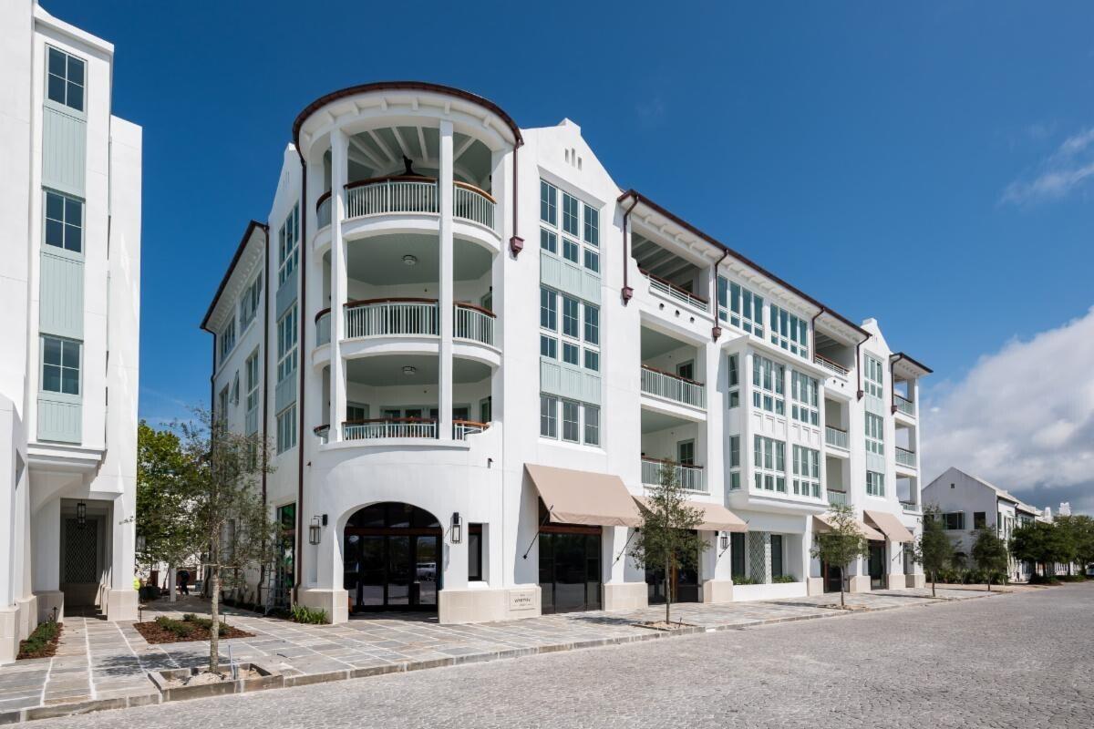Both the Camden and Whitby hold a prominent luxury residential location in the Town Center of Alys Beach, as well as offer unique retail experiences. Architectural cousins, related but unique, each building is expressive of its own distinct personality. The architecture of these buildings borrow from the rich traditional vernacular of Bermuda and the sculptural plaster language evolving at Alys Beach and are seamlessly woven into the fabric of the Town Center. The architectural details comprised of retail steel windows, iron balconies, crafted tile and large openings add a touch of modernity to the traditional and familiar forms of the massing.
These residences were carefully crafted to take full advantage of their prominent location anchoring the Amphitheater.