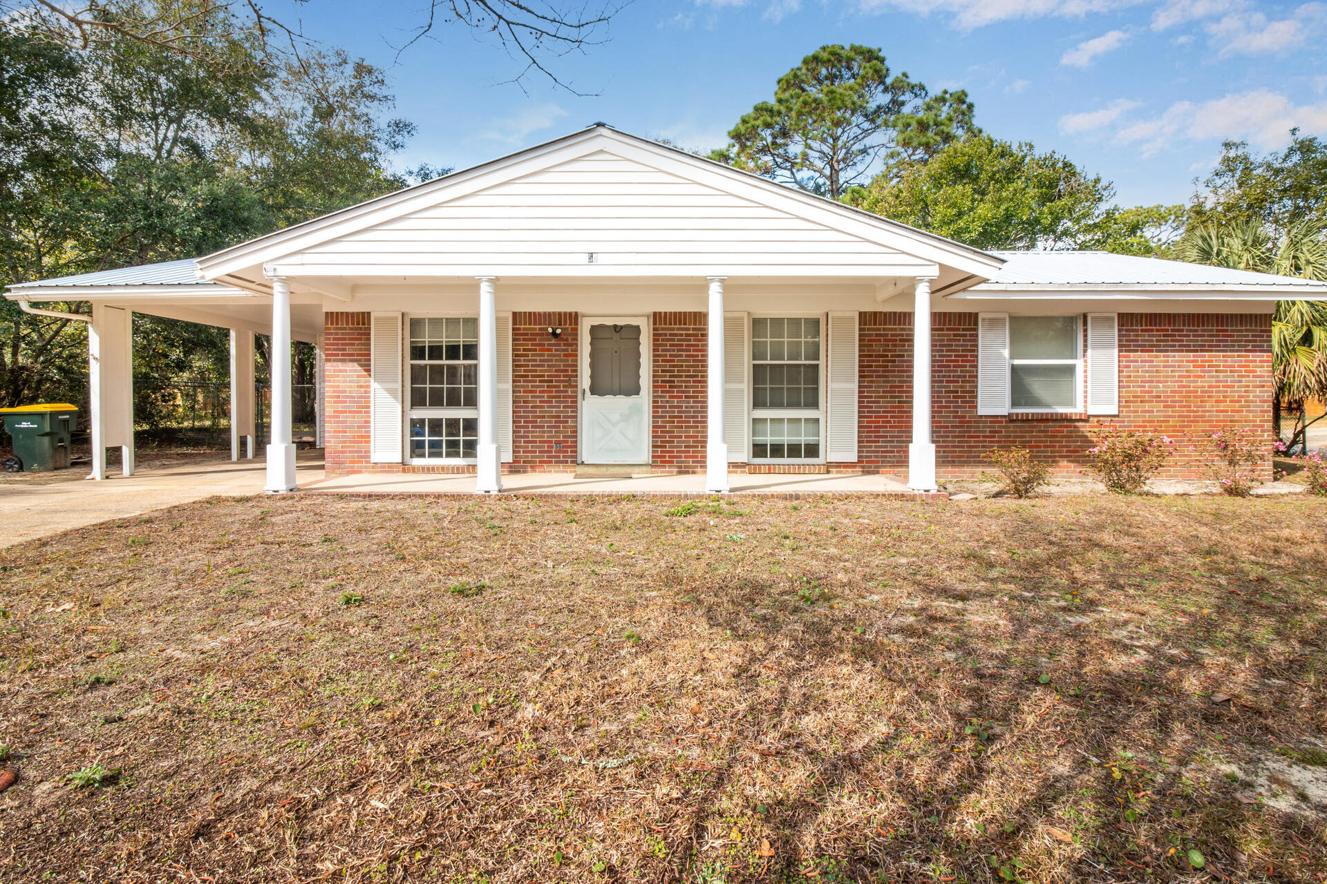 Corner lot with a spacious, fenced backyard!  Exceptionally neat and well maintained home in a friendly neighborhood. A/C replaced in 2018.  Large closet in all bedrooms, inside laundry room with storage. This 3 bedroom, 1 1/2 bath home a block from Elliot Point Elementary School and .5 mile from Uptown Station & Eglin Pkwy. Carport has extra storage, separate workshop & a 10x12 metal shed makes lots of storage available. Double pane windows. Large covered patio. Square Footage is from tax rolls.
