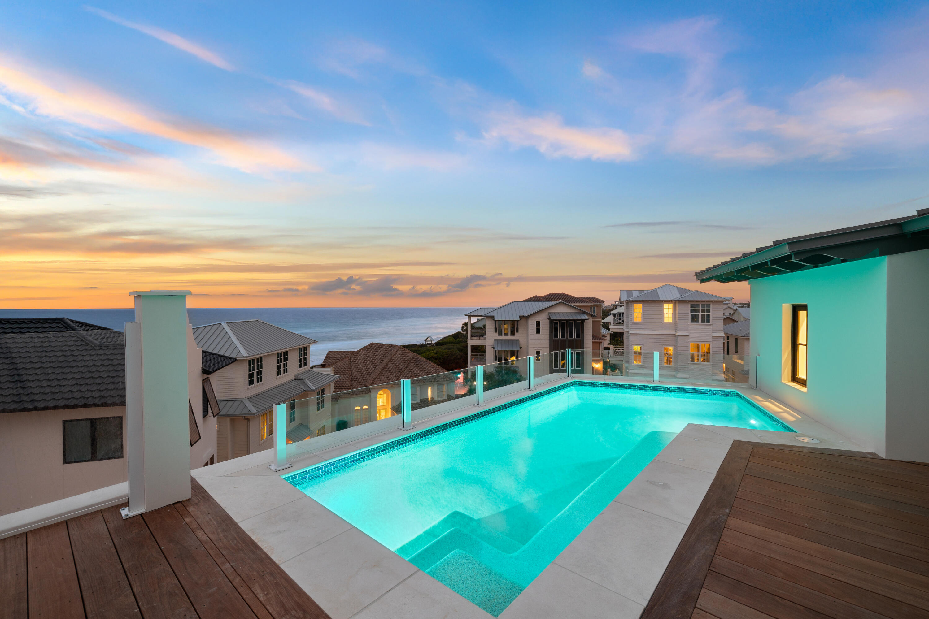 Expertly crafted by Old Seagrove Homes, this exceptional 6-bedroom, 7.5-bathroom residence offers over 6,000 square feet of thoughtfully designed living space in the heart of Seagrove Beach. Perfectly situated between two beach accesses, the home captures panoramic Gulf views and reflects an elevated standard of coastal architecture and craftsmanship.

A rooftop pool and fifth-floor observation deck create an unmatched outdoor experience, offering sweeping vistas of the Gulf that serve as a serene retreat or a dramatic backdrop for entertaining. Every detail of the outdoor design speaks to refined coastal living at its highest expression. Inside, French limestone and wide-plank white oak flooring are laid in a striking herringbone pattern, bringing warmth, texture, and timeless character to the space. Custom cypress built-ins, including a walk-in pantry wrapped entirely in cypress, showcase meticulous attention to detail and a commitment to quality materials.

Venetian plaster walls add a soft, luminous texture that elevates the interiors with understated elegance. A custom fluted wood banquette anchors the dining area with sculptural sophistication, while the brick fireplace offers a classic focal point that grounds the main living space.

Bathrooms are spa-inspired, featuring marble showers enhanced by subtle backlighting for a refined and immersive experience. Designer lighting throughout the home adds layers of ambiance and style, reinforcing the home's cohesive, high-end aesthetic.

With an expansive game room and a generous bunk room, the home is designed with both entertainment and family living in mind. This is a rare opportunity to own a meticulously constructed property in one of 30A's most coveted enclaves, where exceptional design, Gulf views, and proximity to everything Seagrove Beach has to offer come together seamlessly.