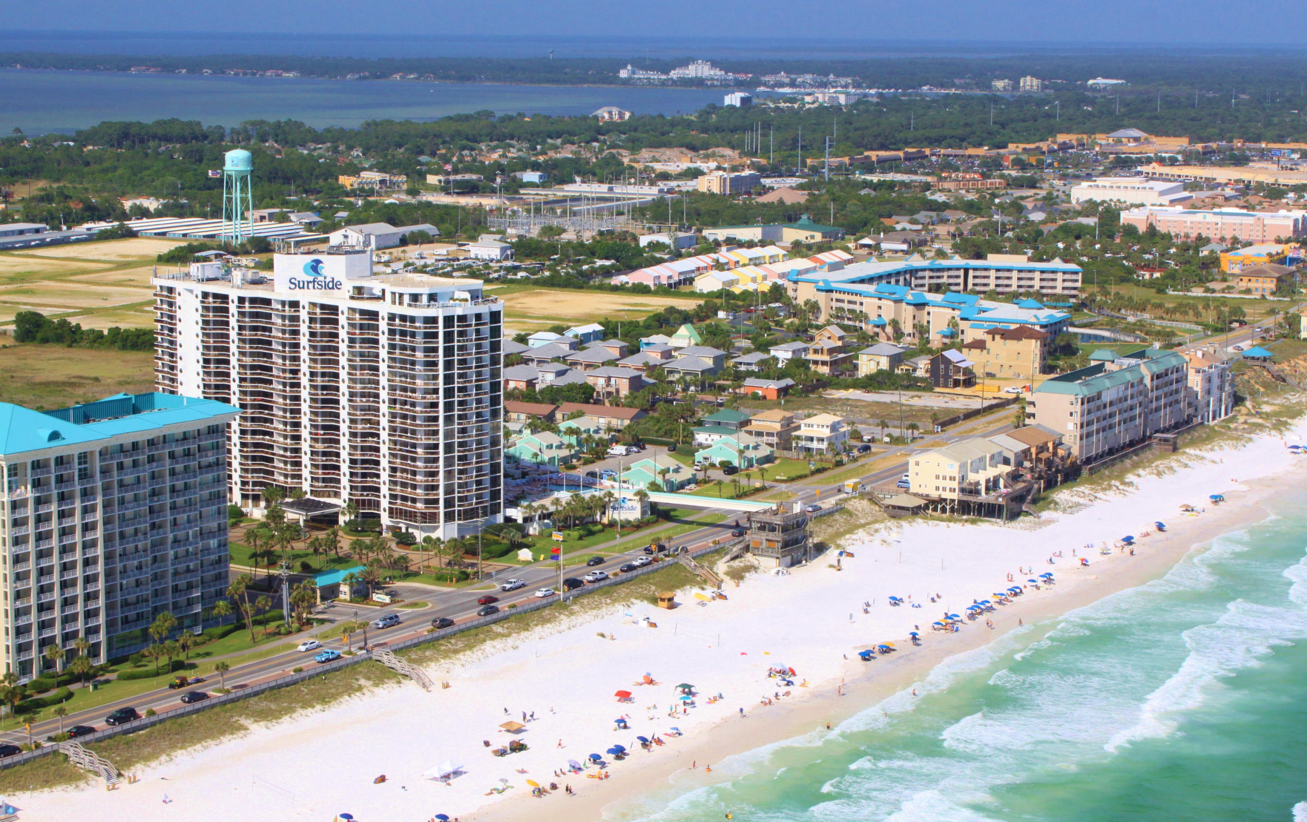 Fully furnished...gulf view!! Own a ground floor one bedroom unit in the popular Destin Surfside for under $190,000. Just walk out to your private walled terrace and take the crossover to the dedicated beach. This home offers large patio area, fully furnished kitchen and neutral frise carpet. New barn doors have been added to the living room, entering the hallway and also on the bathroom. In addition crown molding, new closet doors and a new dishwasher has been added. This is a terrific rental or second home. Surfside offers many amenities- Covered Parking, Meeting Room, Interior Corridors and Elevators, Wake-up Service, High Speed Internet, Heated Pool w/ Hot Tub, Fitness Room, Tennis, Saunas, Basketball, Volleyball, and a Sky bridge to Surfside's deeded beach.