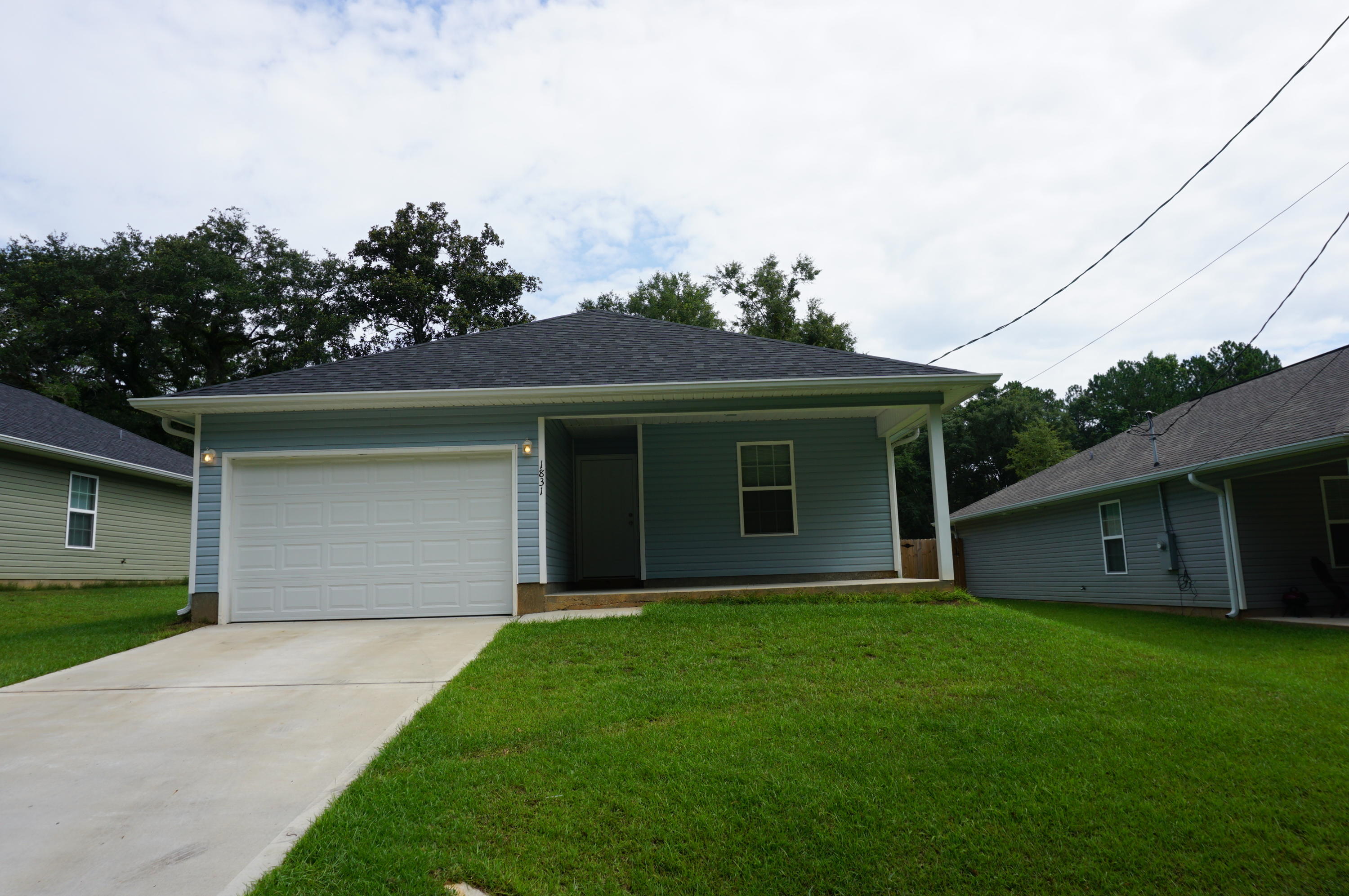 Available 02/11/2019...Country home with 3/2 open concept floor plan. Spacious living room, kitchen with island and granite, plenty of storage and newer appliances.. Additional bedrooms are large and walk in closet in the master. Neutral paint colors throughout and vinyl plank wood flooring throughout. 1 car garage and laundry room. Covered front porch and a privacy fenced back yard, perfect for entertaining. Country living with easy access to base travel, beaches, & shopping. No inside smoking. Pets may be allowed with a $400 non-refundable pet fee and owner approval.