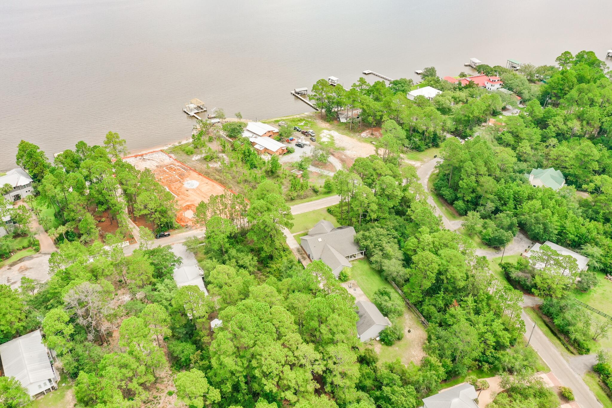 Amazing lot, second tier from the Bay.  Located in the very quiet neighborhood of Bay Pine Shores. The trees on the property are large and beautiful.  Quick access to 331 and 98 for all the shopping, restaurants and our fabulous beach. With just over a 1/2 acre, it is ready for somebodies dream home.