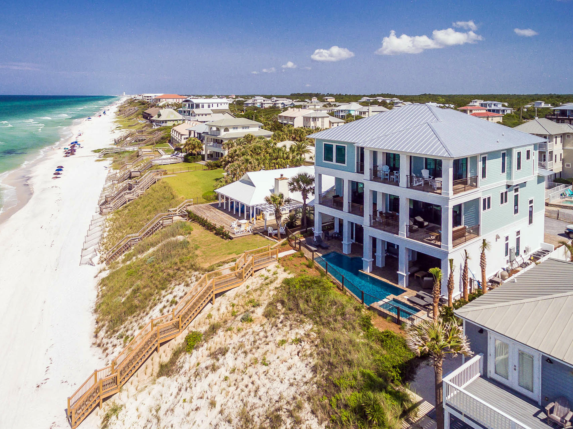 Painted Sky is truly a one of a kind Gulf front residence with an endless list of brilliant features and open, functional living space unlike any other home available on the 30A market. Newly built in 2016, the home is fresh, bright, and put together in a stunningly grand fashion. From the oversized Gulf front pool and hot tub, to one of the most expansive living room and kitchen areas of any home along the 30A corridor, this gem takes Gulf front living to a new bar. Some of the many home highlights include a private beach walkover, 3 living rooms, pecky cypress ceilings, oversized porches with sunset views, two master bedrooms with Gulf views, elevator, and fully decorated with coastal decor. This home is an absolute must see for any serious buyer looking at Gulf front property on 30A. Upon entering the front door, the Gulf views and pool area draw you immediately in. There is a large living room and billiard area with ample seating, a large bedroom with King bed and en-suite bath, and a kids bunk haven with sleeping space for up to 9 and TV's everywhere. As you move out to the pool area, the summer kitchen and outdoor fireplace with TV are icing on the cake to compliment a large private pool and private access to the beach. 

Moving up the stairs or elevator to the second floor, the Gulf views continue to steal the eye's attention, but the pecky cypress ceilings can't be ignored for long. The kitchen and living room area run the entire width of the property on the south side of the home, with double dining room tables, a breakfast nook, double refrigerators, walk in pantry, large kitchen island, beverage center with ice maker and additional refrigerator, bar seating, and surround sound. It's hard to imagine a better space for entertaining luxuriously or for large family gatherings. Windows and sliding glass doors run along the entire south wall keeping the water in sight at all times. There is a large, covered balcony off of the living room area with lounge seating and an additional set of double dining tables. The second floor of the home also includes 2 more bedrooms with King beds with en-suite baths, and a bunk room with 2 twin over twin bunks and full bath.

The third floor of the home is meant to host adults only with 4 bedrooms all accommodating King beds and en-suite bathrooms. The two master bedrooms are situated in the southeast and southwest corners of the home with amazing Gulf views and impressive tongue and groove vaulted ceilings. Both bathrooms have large walk in showers, oversized soaking tubs, and double vanities. Both master bedrooms lead out to a covered balcony with some of the most outstanding views of anywhere in the home. There is also a bonus living room area with wet bar, small refrigerator, and TV. 

Painted Sky is an established vacation rental with projections of $470,000 and $410,000 already on the books for 2017 with 360 Blue Properties. There are few homes on the 30A rental market that command that kind of rental potential. The home is being offered fully furnished and rental ready.