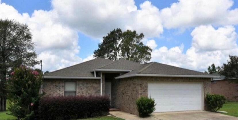 Cute and cozy all brick home in Laurel Hill. Freshly painted with new plank flooring. Stainless appliances to be installed in kitchen and 2 doors to be replaced and it is ready to move in. Brick liana on the back for cook outs or just enjoying the Florida weather. Large back yard with shadow box wood fence for privacy. Shed in the back yard all conveys for storage. Come see it !