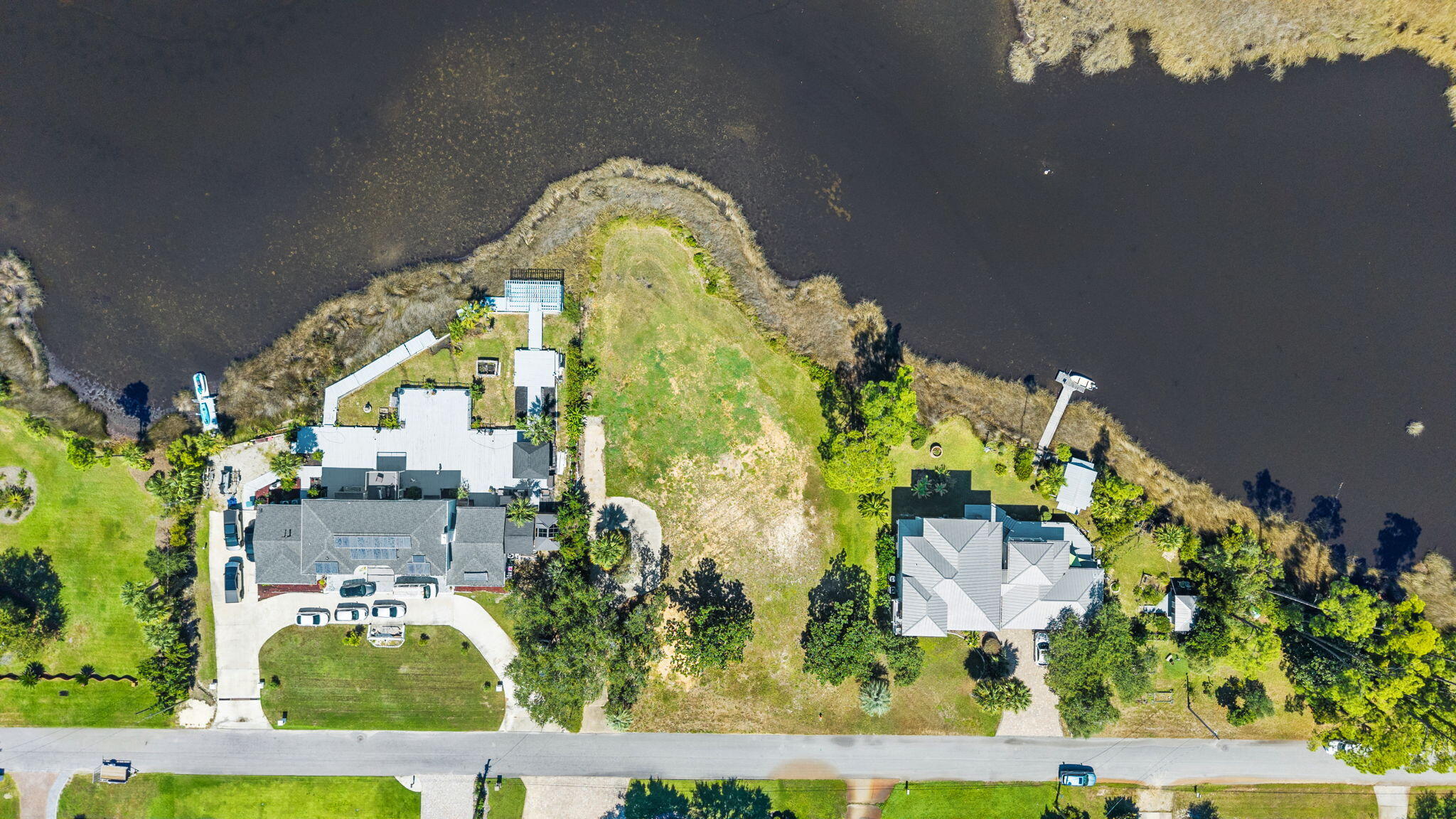 Build your own dream retirement or second home on this beautiful waterfront lot. Sunset views make this lot a preferred choice for a homesite. It offers stunning views stretching across the bayou to North Bay. Located in a well established neighborhood with close proximity to hospitals, schools, grocery stores, coffee shops and fast food. 135' of waterfront and .60 of an acre. Recent survey is available for review.