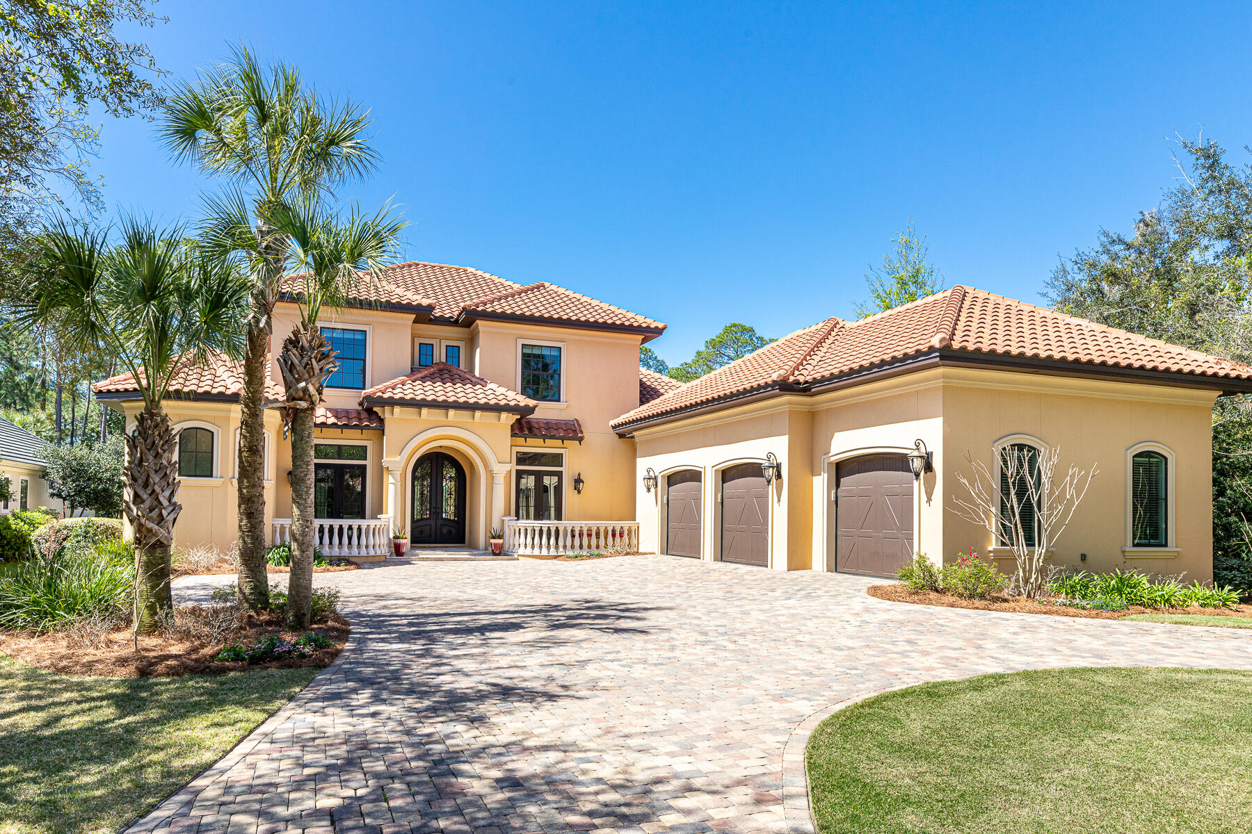 STUNNING BAYOU-FRONT HOME in Regatta Bay of Destin, Florida, including an oversized, climate-controlled 3-car garage (approximately 900 SF, which is not reflected in the living conditioned area measuring approximately 4,178 SF!) Architecturally impressive and imposing in nature, this fabulous home is beautifully oriented on an approximate .84-acre waterfront estate-sized lot, which projects a magnificent streetscape. It is located within the guarded front gate of one of the most extraordinary golf courses along the Emerald Coast of Florida. Ownership... within the community enjoys an array of desirable amenities. Conveniently located just outside the master-planned community's private gates is one of the most popular local marinas and restaurant. The original features of this home, which was constructed in 2018, coupled with the upgraded features the current owner has committed, certifies this as one of the most impressive and value-oriented opportunities in the current local market. This exclusive property will allow a buyer to take full advantage of the waterfront lifestyle in the heart of Destin. Features include but are not limited to the following: a 24'-high entry foyer opens to an attractive formal living room and formal dining room, which feature a gas-burning fireplace, bay windows and lovely chandeliers.  Upon entry to the magnificent foyer, you will enjoy a gorgeous display of a saltwater tank, exhibiting exotic reef fish and corals.  The fish tank system provides for remote monitoring, feeding, and coral dosing, making it an ideal live feature for a second home. Just around the corner is the spacious kitchen and family room and first floor media room. The kitchen features two islands, both with sinks, abundant cabinet space, granite counters, and premium stainless appliances including an Electrolux Icon full freezer and refrigerator, KitchenAid double oven, icemaker, cooktop with (6)-burners and grill, pot-filler, hood, and much more! The first floor includes a luxurious master suite with patio access, large walk-in closet and amazing bath including a walk-in shower with two rain-heads, jetted tub and dual sinks, plus a second master suite directly between the garage and kitchen/family room designed for easy access for older family or guests with mobility issues. The second floor offers a sitting room, another master-sized suite, two additional bedrooms with a shared bath, and a large storage area that could easily be finished into a bonus room. The home features a wealth of conveniences: two Rinnai water heaters, high impact windows, LED lighting, beautiful custom iron front doors, a 3-car garage, security cameras, Bluetooth speakers in each bathroom, a walk-in pantry and butler's pantry closet, blue light on the A/C units to achieve the utmost purity of indoor air, spray foam insulation, attic space over the entire garage, media closet, and wiring for a generator. A LOMA letter has been issued by FEMA, thus providing cost-effective insurability. Outside, the lush lawn and landscaping flows gradually down toward a private nature preserve and the private dock, which extends out to the bayou. Just a short distance via canoe, kayak, paddleboard, or a center console boat, channels you out to the heart of the scenic Choctawhatchee Bay! Just outside the gated community, the central Destin location is ideal for exploring the fabulous beaches, dining, shopping, and extensive activities afforded through the lifestyle of the Gulf Coast of Florida! Additional upgraded features are as follows: all travertine floors polished to a semigloss finish; new wood floors installed in the primary master bedroom, secondary master suite, guest bedroom, and office on the first floor, and the second-floor hall and media room; custom built in cabinets in primary master closet; pool equipment has been upgraded to a new salt system with wi-fi controls for all pool and spa features, which accommodates remote monitoring; a new summer/outdoor kitchen has been installed poolside with premier outdoor appliances including a (6)-burner Blaze gas grill, (2) refrigerated drawers, vented hood, 10' island bar with sink; superior granite was selected for all outdoor kitchen surfaces, including a backsplash from countertop to overhead cabinets; custom glass shower doors were installed in the secondary master suite and guest bedroom; new roman shades were installed in all bedrooms; complete remodel of garage, to include new dry wall, spray foam insulation, custom mirrors in gym area, high-end epoxy tri-color marble design flooring, new paint, new carrier HVAC system that provides complete climate controlled space separate from the main house. The system can also be controlled and monitored remotely via wi-fi. The garage is also wired for 50Amp service that provides power to a Tesla Wall charger. This space adds roughly another 900 square feet of climatized square footage to the main house square footage of 4,178 square feet for a total climatized square footage of just over 5,000 square feet. Please inquire for further details and to schedule your private showing.  Turnkey, furnished  pricing available upon request.