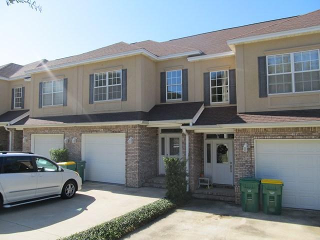This maintenance free and well insulated townhouse is going to make your life a whole lot easier. In a close community surrounded by nature with a communal gazebo and to enjoy a yard you never have to cut! It is a 3 minute drive/10 minute walk to the incredible Turkey Creek facilities with a large pavilion perfect for birthday parties and a beautiful long boardwalk winding over the large creek with informative nature and wildlife markers and swimming decks. The home itself is the perfect blend of functional and spacious. You enter into a tiled foyer leading into the open living and kitchen area. The living space is carpeted with a beautiful fireplace.