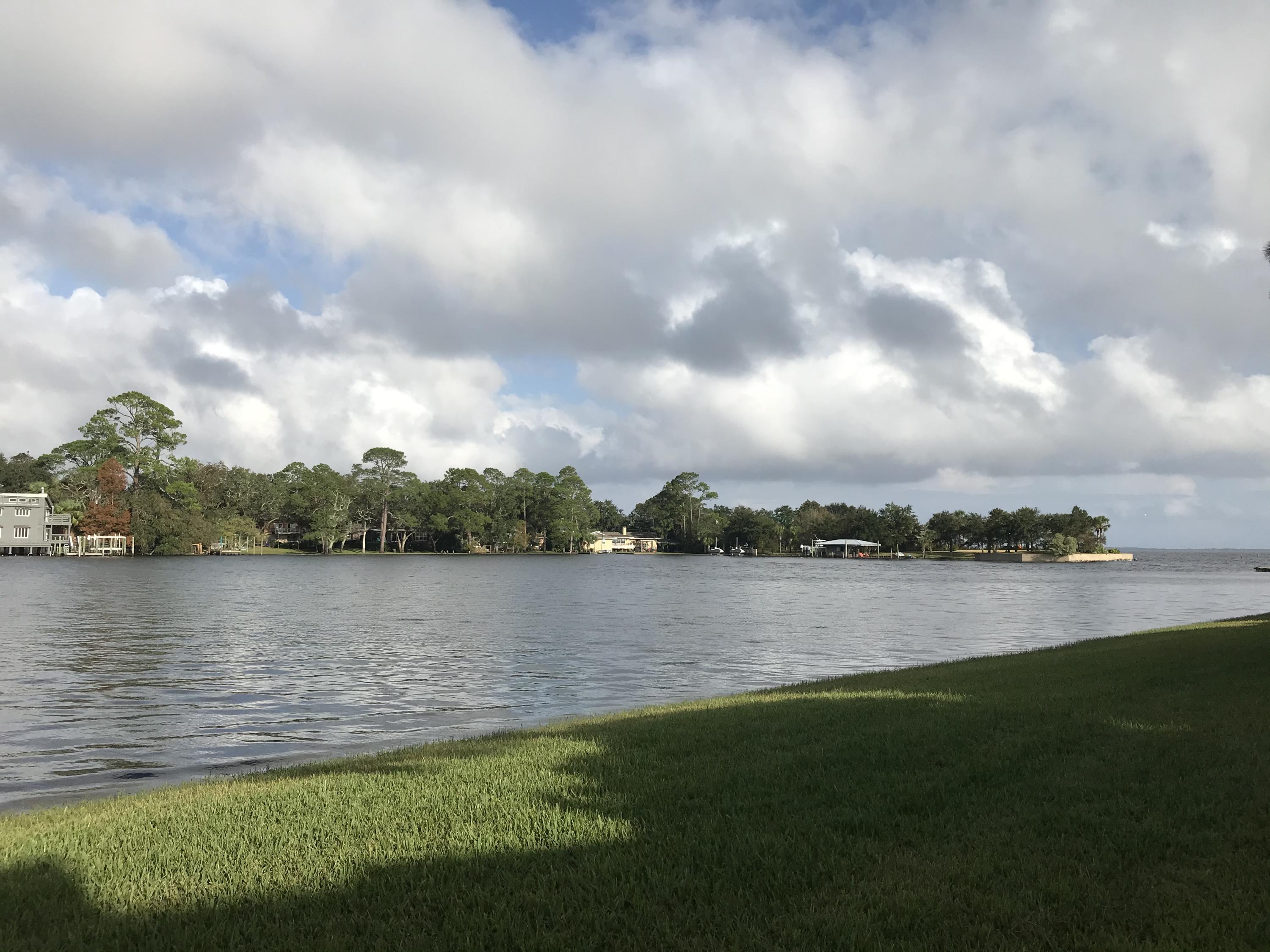 WHAT A GORGEOUS VIEW!  Enjoy your morning coffee or your evening beverage from the patio of this ground floor waterfront unit with an amazing view.  This is a great location in this gated complex,, 2 bedroom, 2 bath condo, open floor plan, tiled floors throughout, updated kitchen with stainless steel appliances and breakfast bar.  A/C new in 2016.  Spacious master bedroom and bath, and guest room with closet including shelving. Assigned parking space steps from this unit.  Community pool and tennis court.  Convenient location to Eglin AFB. Great unit for first time buyer or investor.