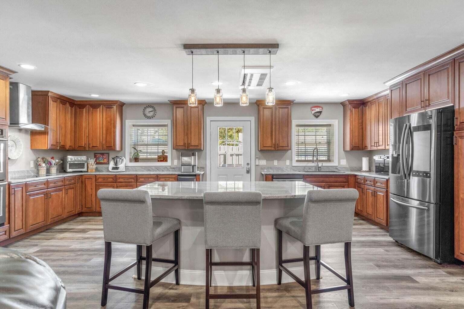 Roomates Considered. 

Unit 2 - 4 BD/4 BA was completely gutted in 2019 with the following improvements: Waterproofing of concrete cinder block, firewall between units installed, NEW insulation, drywall, framing, electrical, plumbing, NEW 80 gallon Water heater, and mini split HVAC system. You should note the mini split system features 6 splits which allows each room in the house to be the same or different temperatures based on preference. The chef's dream kitchen features custom ''Whisper touch soft close'' cabinets by Kraftsmaid with ample storage, a conduction cooktop, vent hood, granite countertops, stainless steel appliances, island with storage, and built-in double ovens, microwave, and ice machine. Easy to clean LVT flooring throughout except for tile in the bathrooms.