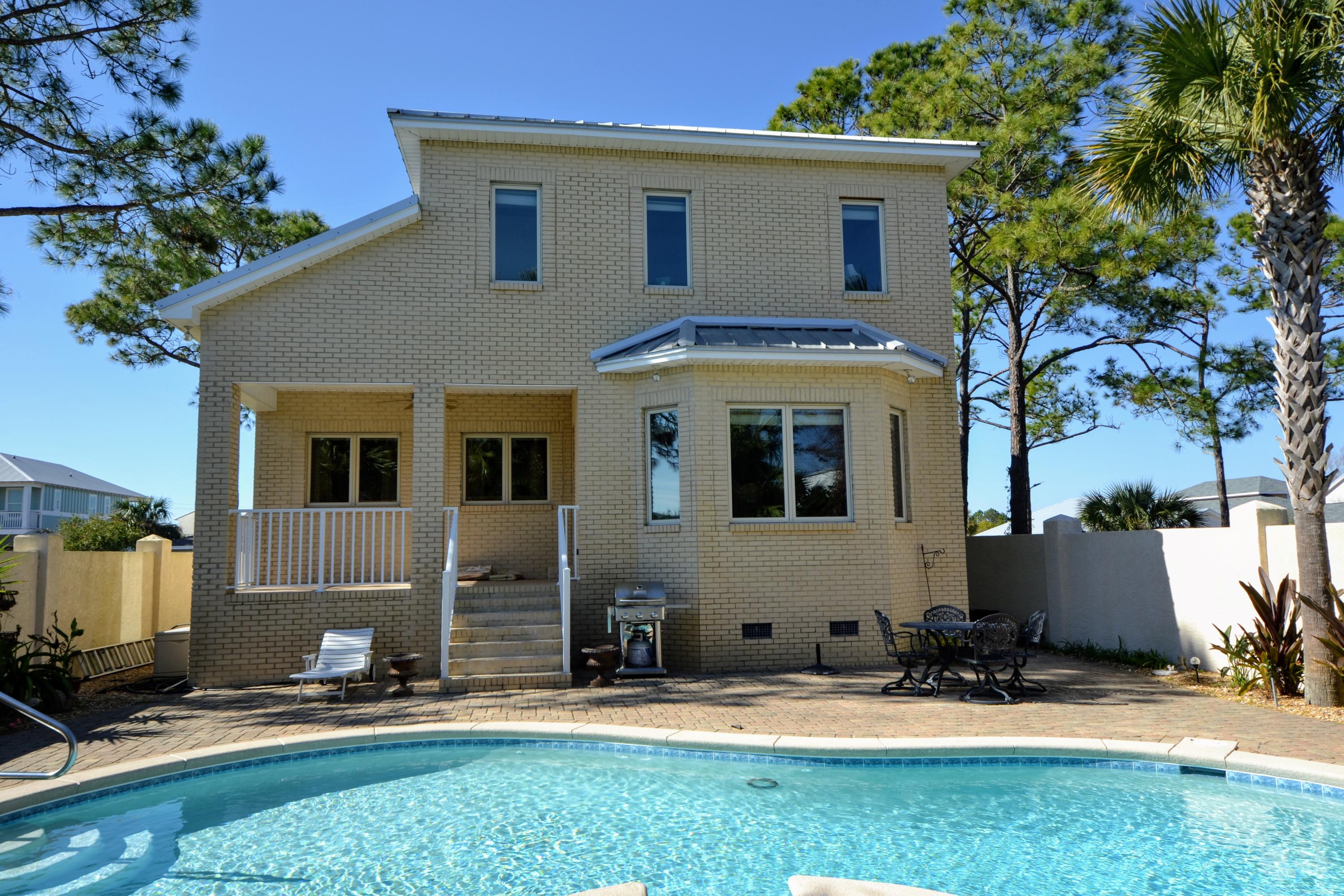 Custom Built Home Located in a Gated Neighborhood on the Popular West end of Panama City Beach, and Just a Short Walk to The White Sands of the
Gulf of Mexico, Close to Shopping, Restaurants, Pier Park and 30A. Upgrades include Granite Counter Tops & Italian Tile in the Kitchen & Bathrooms, Oak Cabinets,
Breakfast Bar, Dining area overlooking the Heated Private Salt Water Pool, Solid Oak Flooring, Large Master Bedroom with Walk-in Closet, Master Bath with Walk-in
Shower and Double Vanity, Stainless Steal Appliances, Rinnai On-Demand Water Heater, Central Vacuum System and a huge 2 Car Garage with Plenty of Storage
and it's own Bathroom. The Walled Back Yard is beautifully Landscaped and there is a cute Maintenance Shed to Store all your Garden tools.
