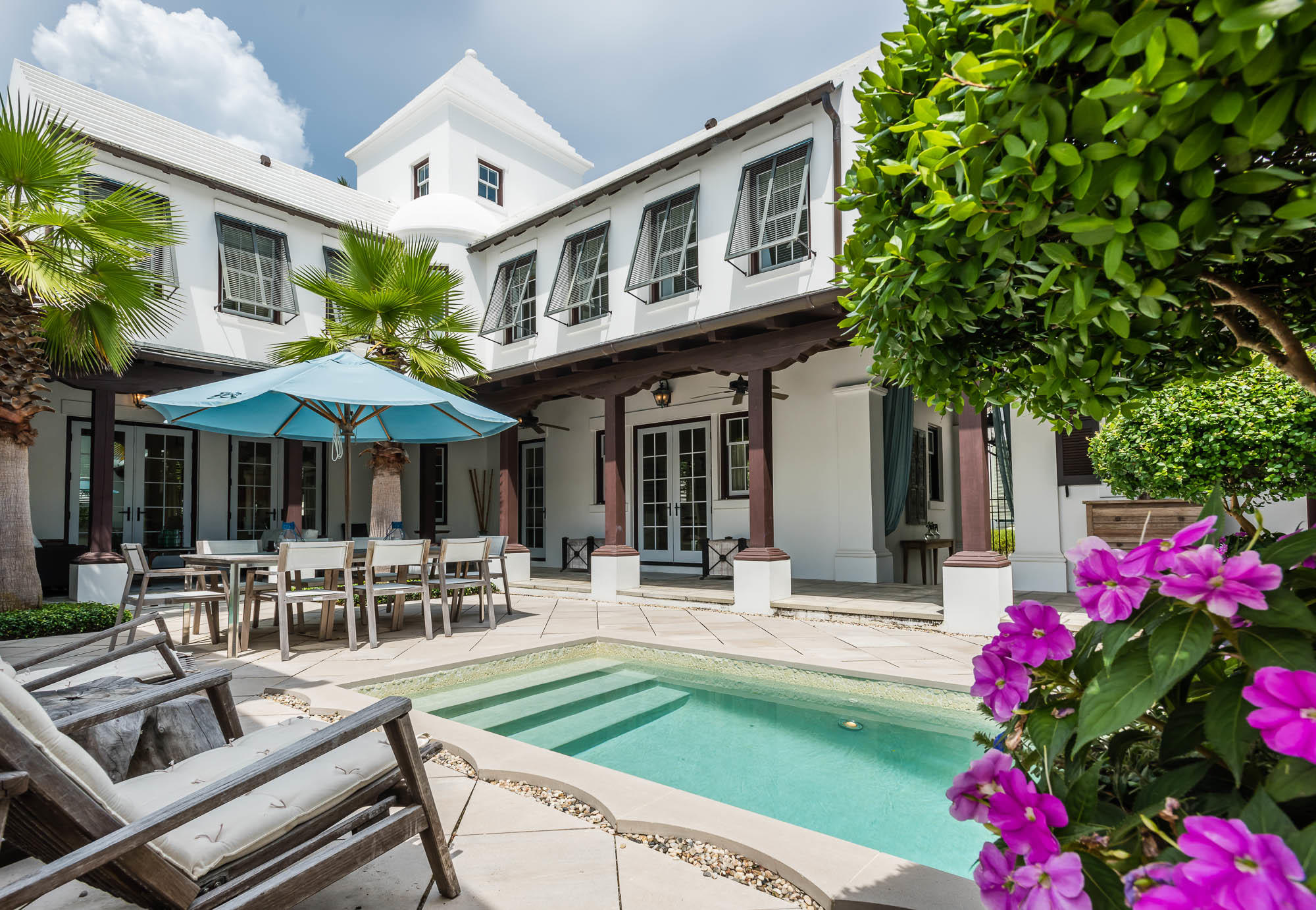 Once featured in Veranda Magazine, this awe inspiring Steve Mouzon Design features impeccable furnishings by interior designer, Georgia Carlee. The home surrounds the large courtyard allowing for outdoor dining, sunning, and shade. The first floor master suite, living and dining rooms, followed by the kitchen feature expansive windows which look upon the beautiful courtyard and pool.
Entertaining is a cinch! The professionally equipped kitchen, featuring a 48 Wolf Range accompanied by the Sub-Zero Refrigerator, opens to the dining room creating the perfect hosting scenario. White-washed cherry cabinets above and below the Azul Imperial granite countertops create beauty while dining. The palette of white, sand, and pale blues is a perfect ambiance to this stunning home.
A soo A soothing fireplace highlights the expansive living area. Three sets of French doors open to the courtyard which offers a welcoming interchange of outdoor living and natural light. Open the doors to enjoy the sound of the pool fountain while gazing across the creeping fig and palms. The courtyard living is unforgettable given its array of lush landscaping, furnishings, and pool with fountain.  The outdoor shower is private allowing for outdoor bathing after a day at the beach.  

The first floor master suite creates privacy to the common areas of the home trailed by three guest bedrooms on the second floor. The master suite looks upon the courtyard and pool while having its own private court.  In the master bathroom, two closets, a walk-in shower and a soaking tub sitting beneath the 25' light tower creates an environment of a distant destination.

Should work interfere, you can occupy time in the study, located off the master suite which opens to its own courtyard allowing for breezes and sounds of nature to visit.  

Leaving the home you can take a right on Sea Garden Walk leading to the Gulf of Mexico or left to the Fire Pit, Caliza Pool, and Lake Marilyn.  Indoor and Outdoor living are woven as one with this property.

This home is built to "Fortified....for Safer Living Standards."