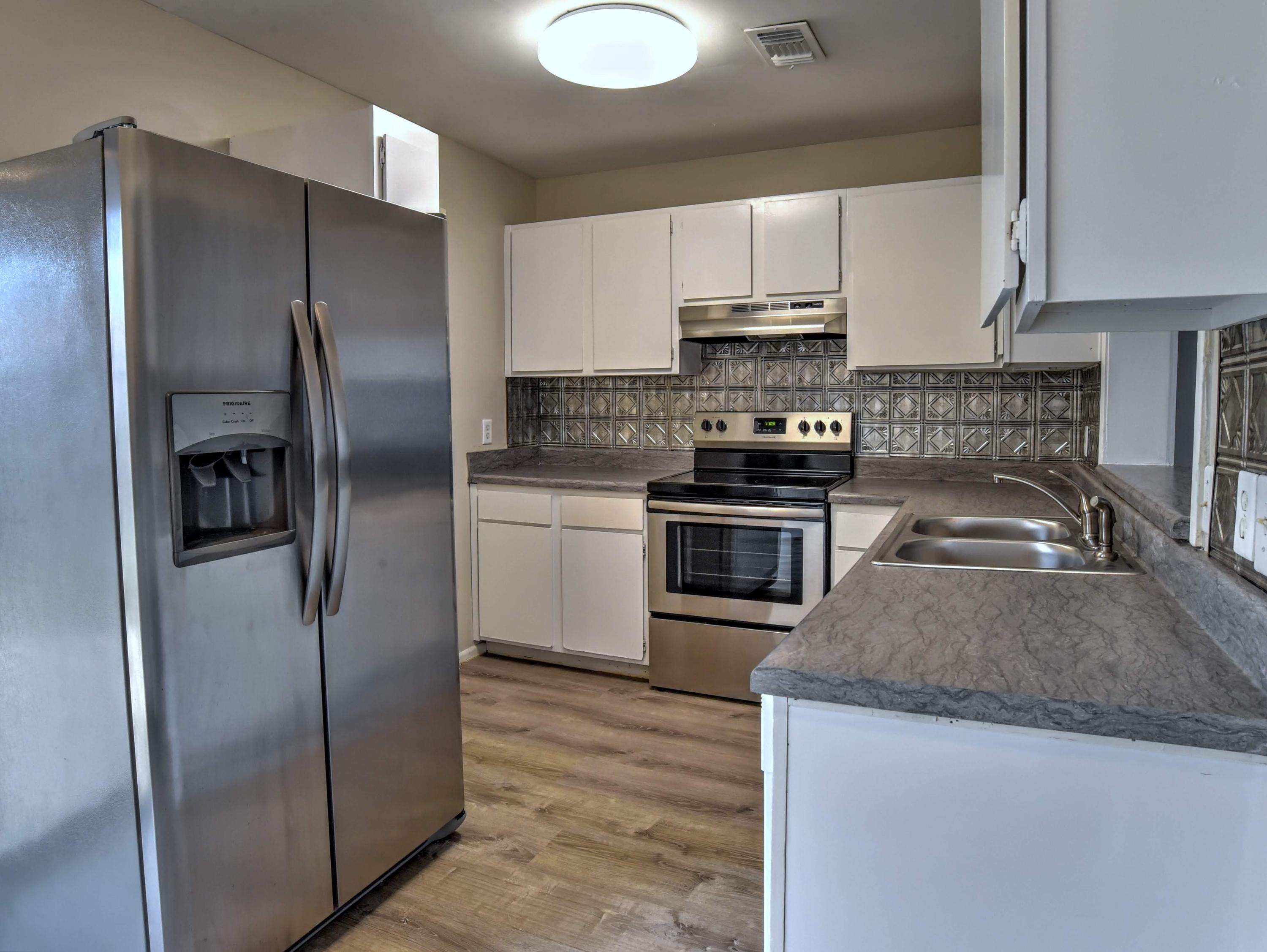 Located in the heart of Destin and centrally located close to everything Destin has to offer. Between Main Street and Beach Drive and just minutes to the beach. This home sits on a corner lot. Upgrades include - Fresh paint throughout with Sherwin William Agreeable Gray, Stainless Steel appliances by Frigidaire, double sink with disposal, new kitchen exhaust fan, new countertops in a muted grey. The bathroom was taken to the studs and totally redone including tile floor that looks like wood, new bathtub, toilet, vanity/sink and light fixture. New flooring throughout featuring vinyl plank (NVP) flooring downstairs and new carpet up the stairs and in both bedrooms. Indoor laundry area with full size washer/dryer and enough room to add a 1⁄2 bath. Backyard features a privacy fence. covered patio.  New Ceiling fans, smooth ceilings, new light fixture in kitchen and new roof replaced in October, 2017.  Great for young families, second home, or investment.  Townhomes in this complex do not last long!