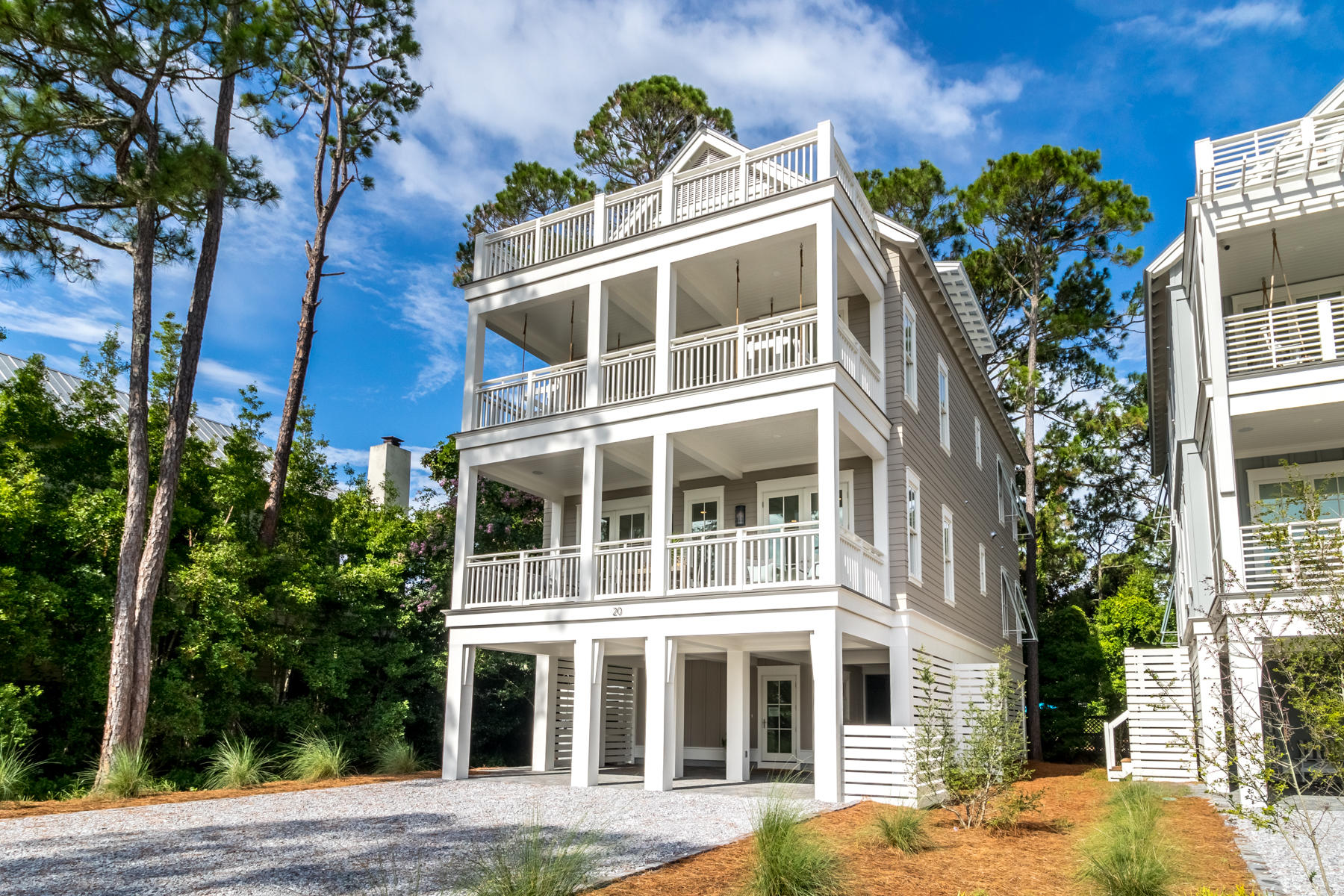 This 5 bedroom, 5-1/2 bath custom built home with a private boat slip is a family or investors dream. This exquisite Magnolia Floor Plan custom built by local builder Luke & Blue boasts 3658 SqFt of living space and spectacular views of one of the most beautiful coastal dune lakes. Each floor of this home provides impressive views of Western Lake all while overlooking the community swimming pool area. Grayton Landing is a gated community with 175 linear feet of frontage on Western Lake & a private boat launch. Open concept living is truly represented in this home. Behold the lake views as you enter the 2nd floor into the inviting custom built kitchen. The solid wood cabinetry with dovetail joinery and cushioned close hardware, quartz countertops, Wolf 36'' 6 burner all gas range and
Sub-Zero 36'' built-in refrigerator are some of the features of the kitchen. The hospitable open living allows for dining and entertaining indoors and al fresco on one of the two covered porches. The master suite completes the 2nd floor living area with a custom built walk-in closet. The en suite bath showcases multiple shower heads, dual vanity sinks with quartz countertops and a freestanding bathtub. Take the stairs or better yet, ride the elevator to the 3rd floor! This floor has an additional three bedrooms and laundry. The two western facing bedrooms also have en suite baths with custom cabinetry and quartz countertops. One of the bedrooms has a walk-in closet while the other has 2 separate closets allowing for additional storage space. Facing the waters of Western Lake is the 2nd master bedroom. Instant relaxation is the feel of this master bedroom. Views of the lake can be enjoyed while relaxing in your chamber or step outside onto the covered porch enjoying a glass of wine to end the day. The en suite bath is not to be missed in this gorgeous master suite. Custom cabinetry, multiple shower heads, double vanity sinks and more details that highlight luxury. The 4th floor is an absolute treat to those who enjoy natural light. This final level has a custom built bunkroom with FOUR closets with a balcony allowing for natural light to encompass the room. Grab a cold drink at the wet bar on the way to the loft area of this floor to enjoy the beauty of coastal Florida living. The open porch with Trex decking ensures many years

Community features include: private gated community with 6 exclusive residences situated on 1.5 acres on Western Lake, community swimming pool fronting Western Lake with sundeck, outdoor kitchen, grill & bathrooms, private access to Western Lake including; boat dock with 6 slips (each owner has an assigned slip) & boat ramp, approximately 175 linear feet of frontage on Western Lake & a 5-minute walk to the white sand beaches of the Gulf of Mexico.