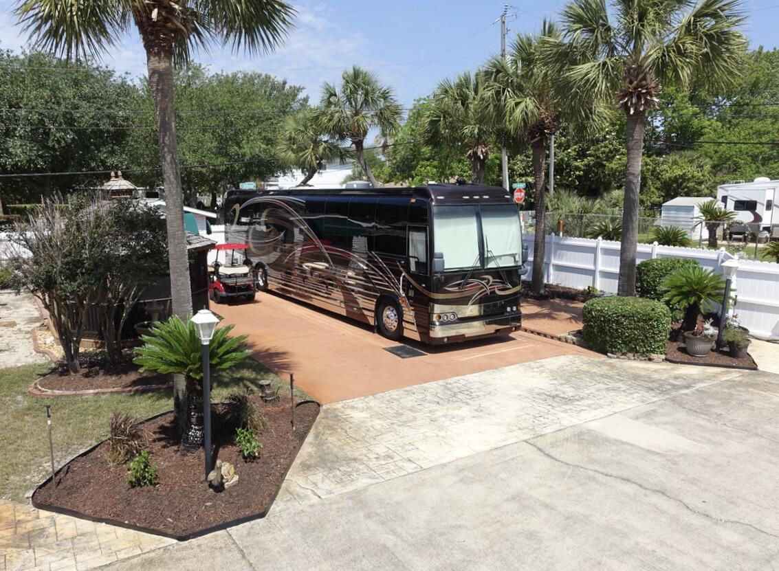 Oceanside, the Exclusive 'Class A'/'Super C' Motorhome 15 Lot Gated Community, with a Pool & only 2 blocks from the Beach. Enjoy the privacy of the largest End lot located on the West side, across from the Pool & Pool house. Lot 15 is a spacious lot with new landscaping & added Composite Decking outside the Screened Gazebo with Seating Area, Stove, Sink & Storage. The Storage House has Air Condition & is smartly finished with built in Cabinets & countertops providing ample storage. NON-rental Gated Community of 15 lots with Palm trees, sprinkler system, Pool, Pool House with Laundry, Restrooms & Shower. $2500/yr HOA Fees include Ground Keeping, Irrigation, Security Gates, facilities, Community Pool, Sewer, Water, Trash. Owners Pay Electric & Cable.2 Pets with Breed Approval. NO 5th wheels. Conveniently located 2 blocks from one of South Walton's largest Public Beaches, parking areas, public bathrooms near Pompano Joe's Beachside restaurant,Bike/Pedestrian Path & Manmade Reef. Grill, Fountain & Chairs in Gazebo Excluded from Sale. NO 5th Wheels or Trailers. NON-RENTAL PARK. Buyer Pays $500 Capital Contribution at Closing. Seller also has 2012 Prevost Entertainer Coach, with 1 Bedroom/Bath/Shower & Kitchen for Sale $399,000.