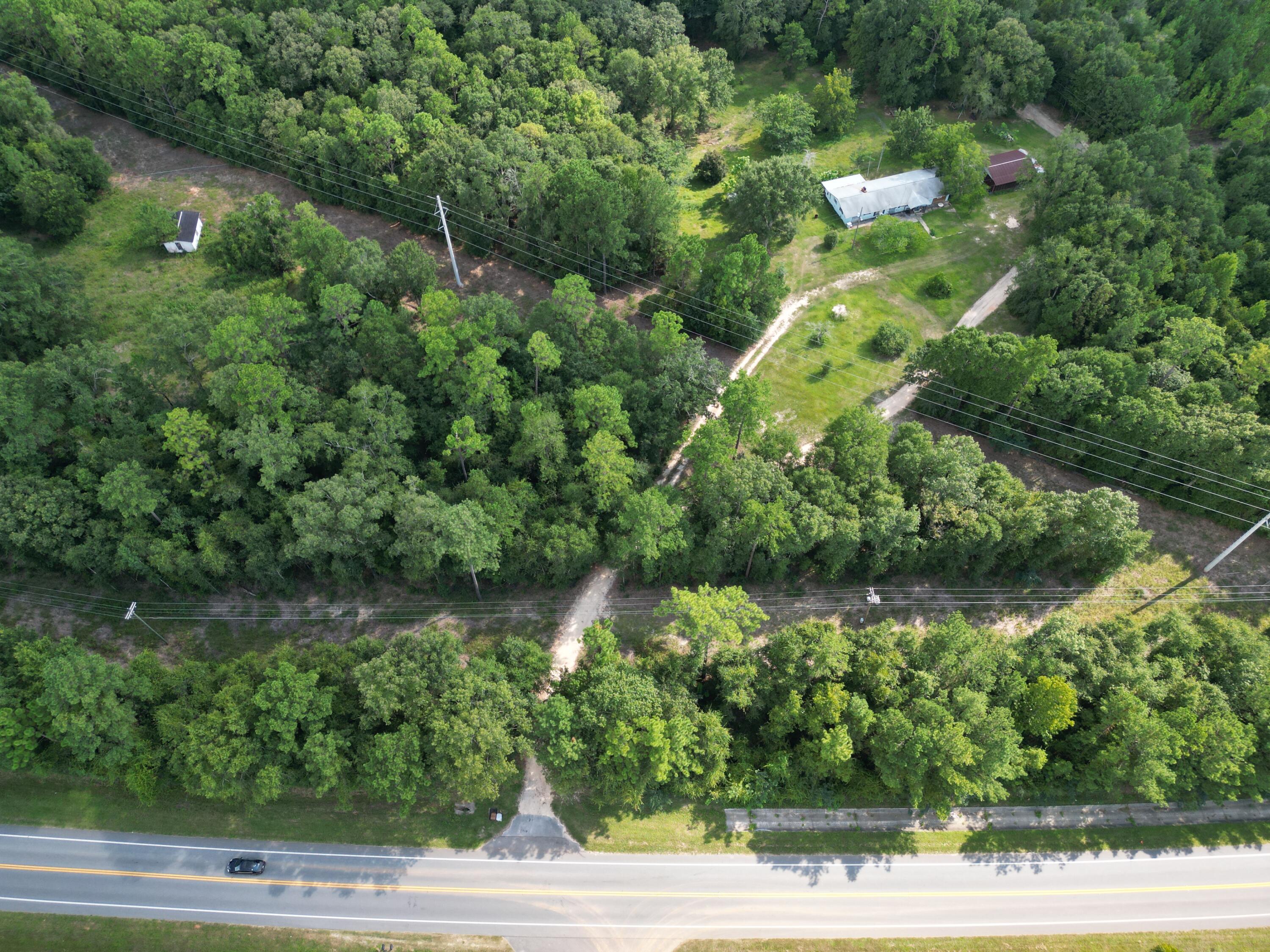 ******MOTIVATED SELLER . BRING ALL OFFERS******Welcome to your future 4 acre country home site! Property is partially cleared and wooded. Power and water are available. Property is about 5 mins from a public boat ramp on Escambia River. Enjoy fishing, horseback riding, camping, and all the fun outdoor activities just a short distance from your home. Paved road frontage on Hwy 4. Close proximity to schools, grocery stores, shopping, and eateries. Zoned AG-RR 1 dwelling per Acre can be divided into 3 parcels with a shared driveway. PER THE COUNTY : can get 4 parcels if they are split into 1 acre lot