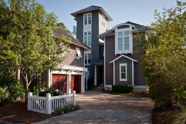 284 Yacht Pond was designed by renowned Tom Christ Architects. The 5 bedroom, 5 bath home boasts unparalleled views of the Gulf just beyond the untouched sand dunes of Watersound. The perfectly private lot lines the conservation area of Watersound Beach and will always remain preserved. The interior features two master suites, reclaimed hardwood floors throughout, old Chicago brick floors and fireplace, Italian tile in the laundry and carriage house, elaborate wood detailing, a custom metal stair handrail and fireplace, and rustic barn doors in the master suite; these details give the house lots of character. The exterior of the house was not spared when the property was designed to perfection. There are gorgeous Bevolo copper lanterns, extensive landscaping, irrigation, and exterior lighting. The home offers too many wonderful features to list; call for a list of details!  This happy home is situated in the town of Watersound Beach, an exclusive gated community, offering some of the most lush parks and greens along 30A Owners here enjoy pools, a private beach, a fitness center, and more. The shopping and dining experience is unparalleled with arguably some of 30A's best culinary destinations and most unique boutiques.  A robust events program entertains families throughout the year with movies, festivals, concerts and much more. And of course the wide stretch of sugar white sand and glittering turquoise Gulf waters complete this quintessential beachfront town. Carriage house sold furnished. Main house sold unfurnished.