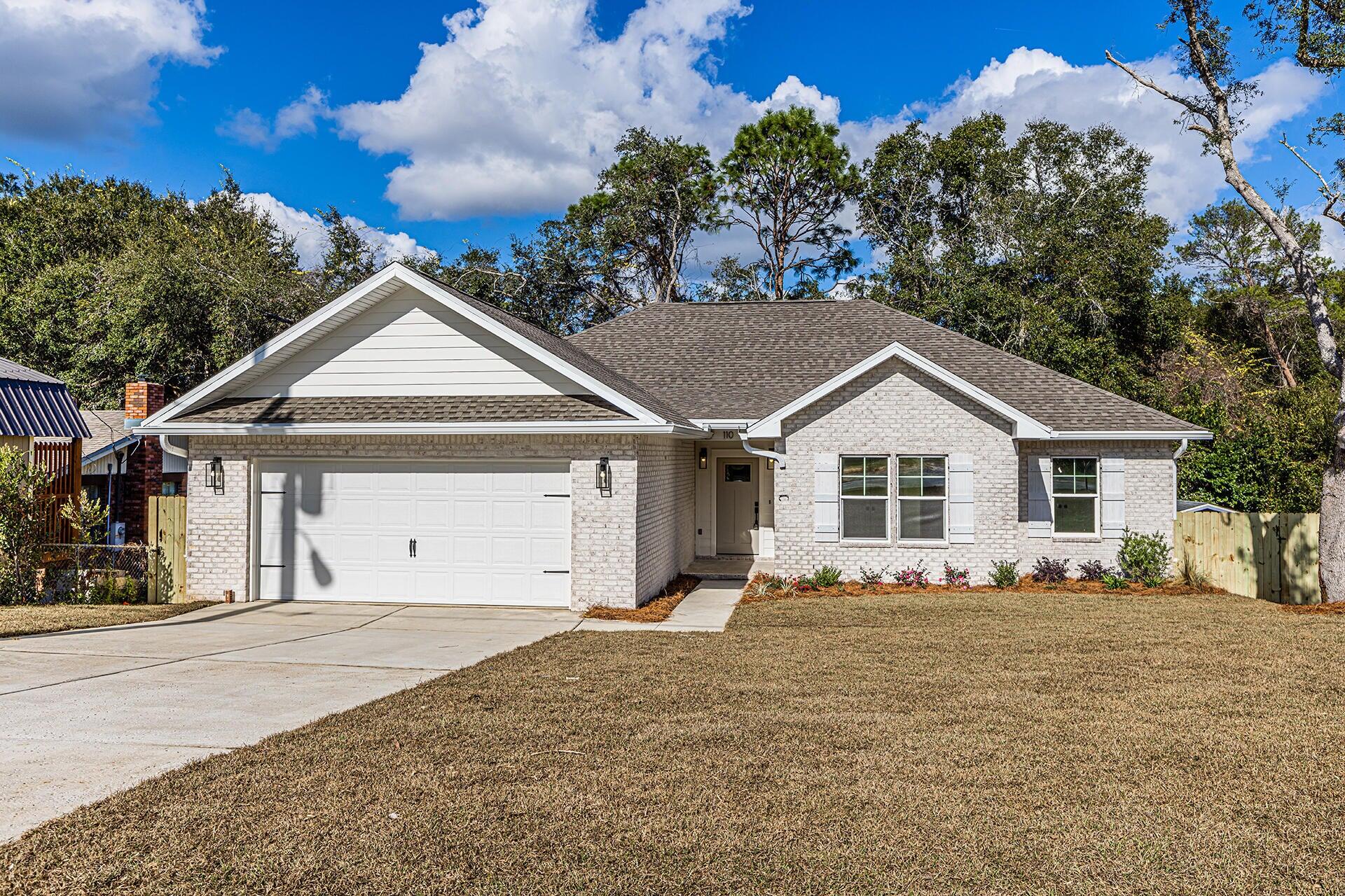 Welcome to this stunning 4-bedroom, 2-bathroom home in Niceville. This property boasts an open floor plan that allows seamless transitions between spaces; perfect for entertaining or simply enjoying the flow of everyday living. The master suite is a true retreat, featuring a trey ceiling that adds an elegant touch. The en-suite bathroom is equipped with a double vanity, offering ample space for personal necessities. Step outside to the covered patio, an ideal spot for outdoor dining or simply relaxing with a good book. The fenced backyard provides an added layer of privacy and space for outdoor activities. This home perfectly blends style, comfort, and convenience, making it a must-see property. Contact us today for a showing!