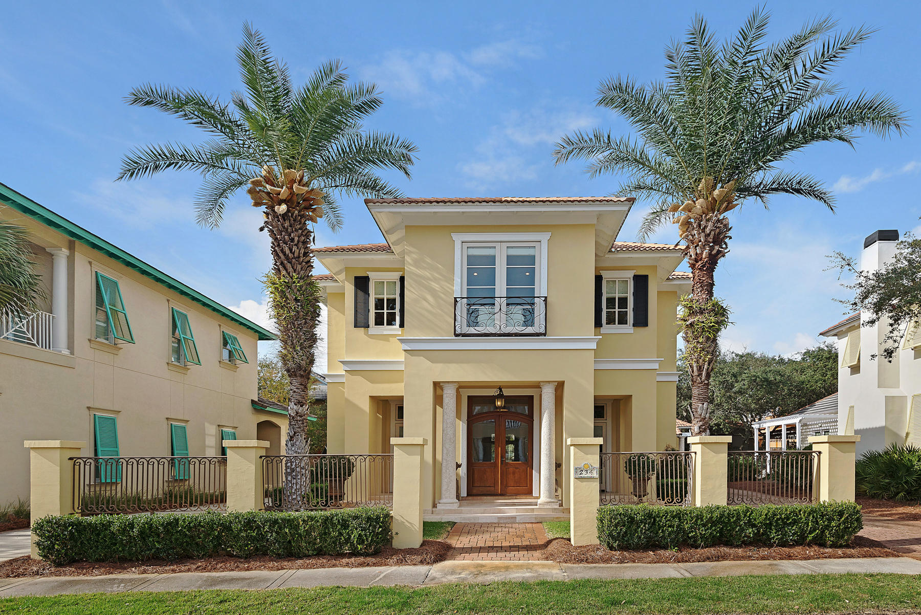 Exquisite French Country Estate in Caribe. Understated elegance overflows in this sunny 5BR/4.5BA chateau. Caribe's private beaches are less than a two-minute walk. Curved arches, soft lines, stone counter tops and custom iron stair railings enhance 234 Rue Caribe's rustic warmth. Inviting interiors include an entertainment room, formal dining, casual dining and a spacious family room with gas fireplace. The cook's kitchen incorporates a Viking 6 burner gas stove; Bosch dishwasher, Subzero refrigerator and wine refrigerator in old-world cabinetry. A master bedroom balcony and an expansive rear patio with a gas fireplace frame the home . The guesthouse includes a wet bar/sitting area, bedroom and loft. All furnishings blend seamlessly with the home's patina and are included in t